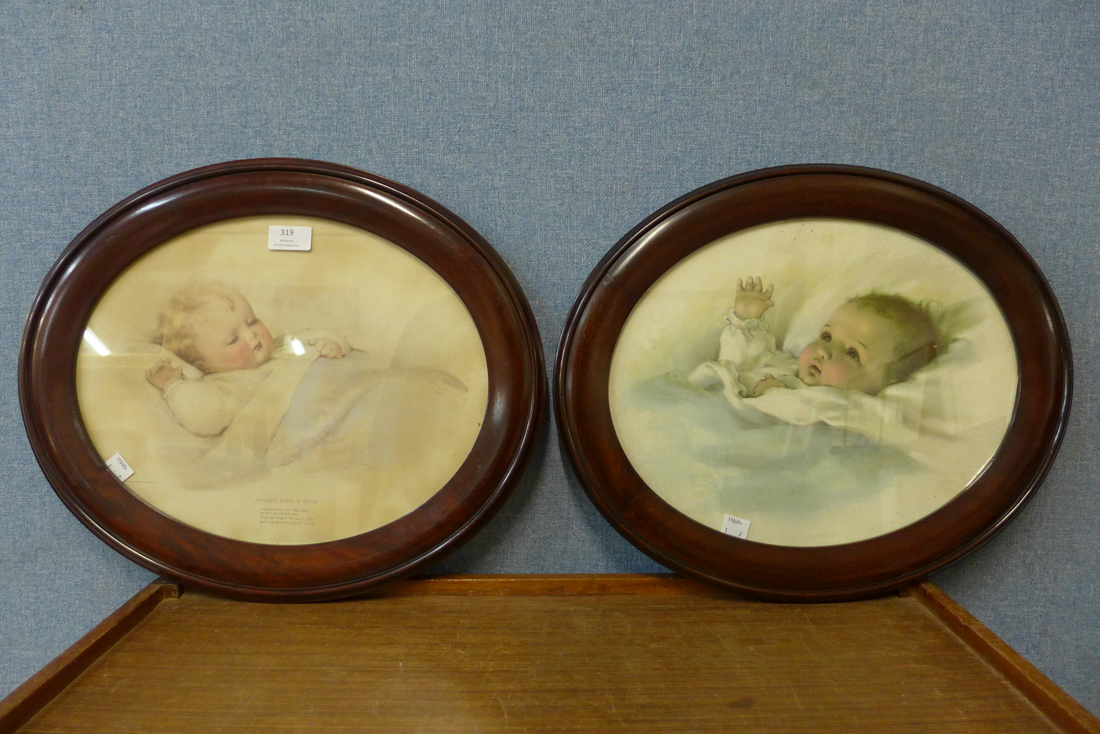 A pair of Bessie Pease prints of babies, both framed