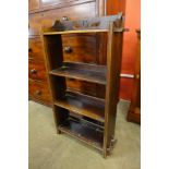 A small Arts and Crafts oak open bookcase