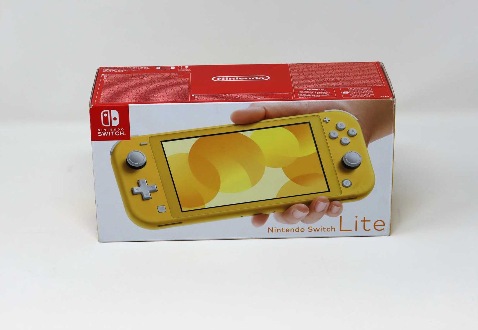 A boxed as new Nintendo Switch Lite in Yellow (box opened).