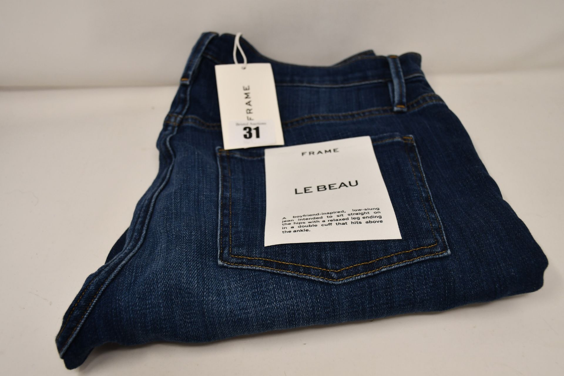 A pair of as new Frame Le Beau jeans in Burnside (Size 28).