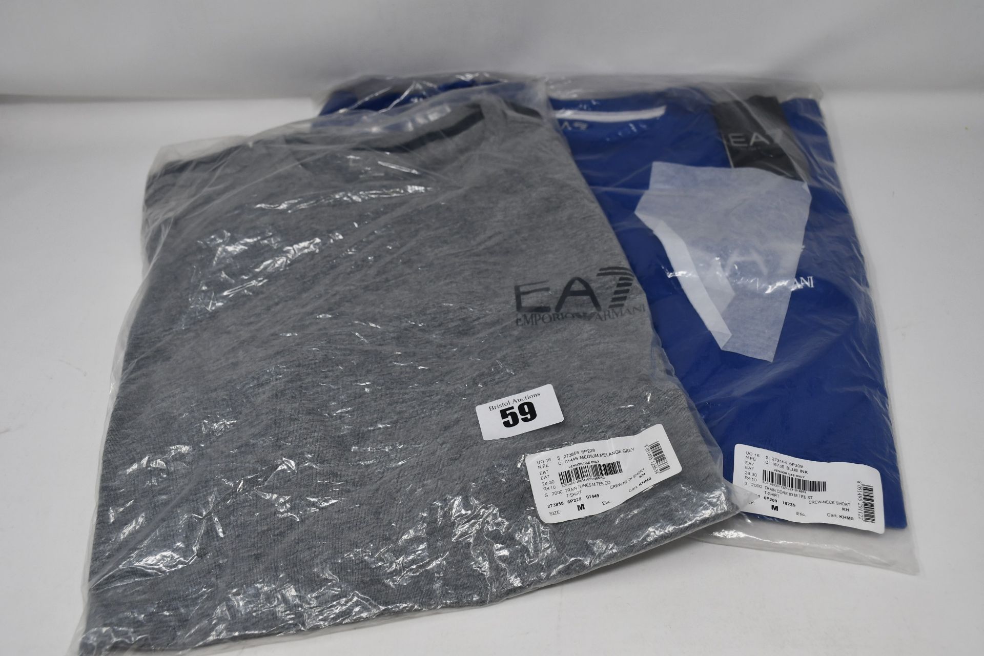 Two as new Emporio Armani EA7 T-shirts, one grey and one blue (Both M).