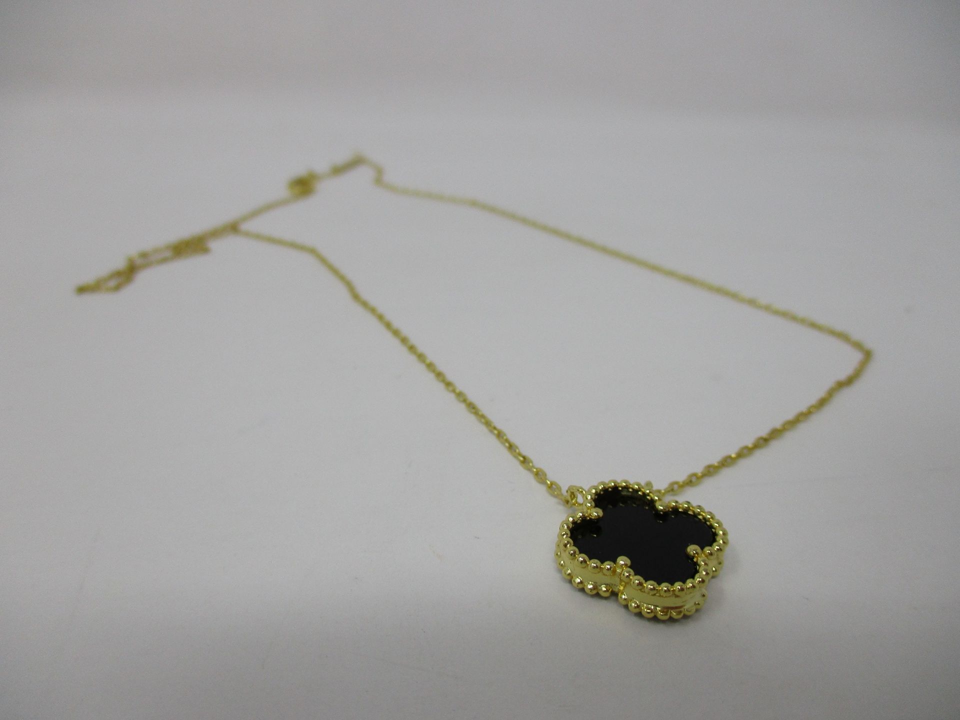 One boxed as new Van Cleef & Arpels Vintage Alhambra Gold and Onyx Pendant. - Image 2 of 4