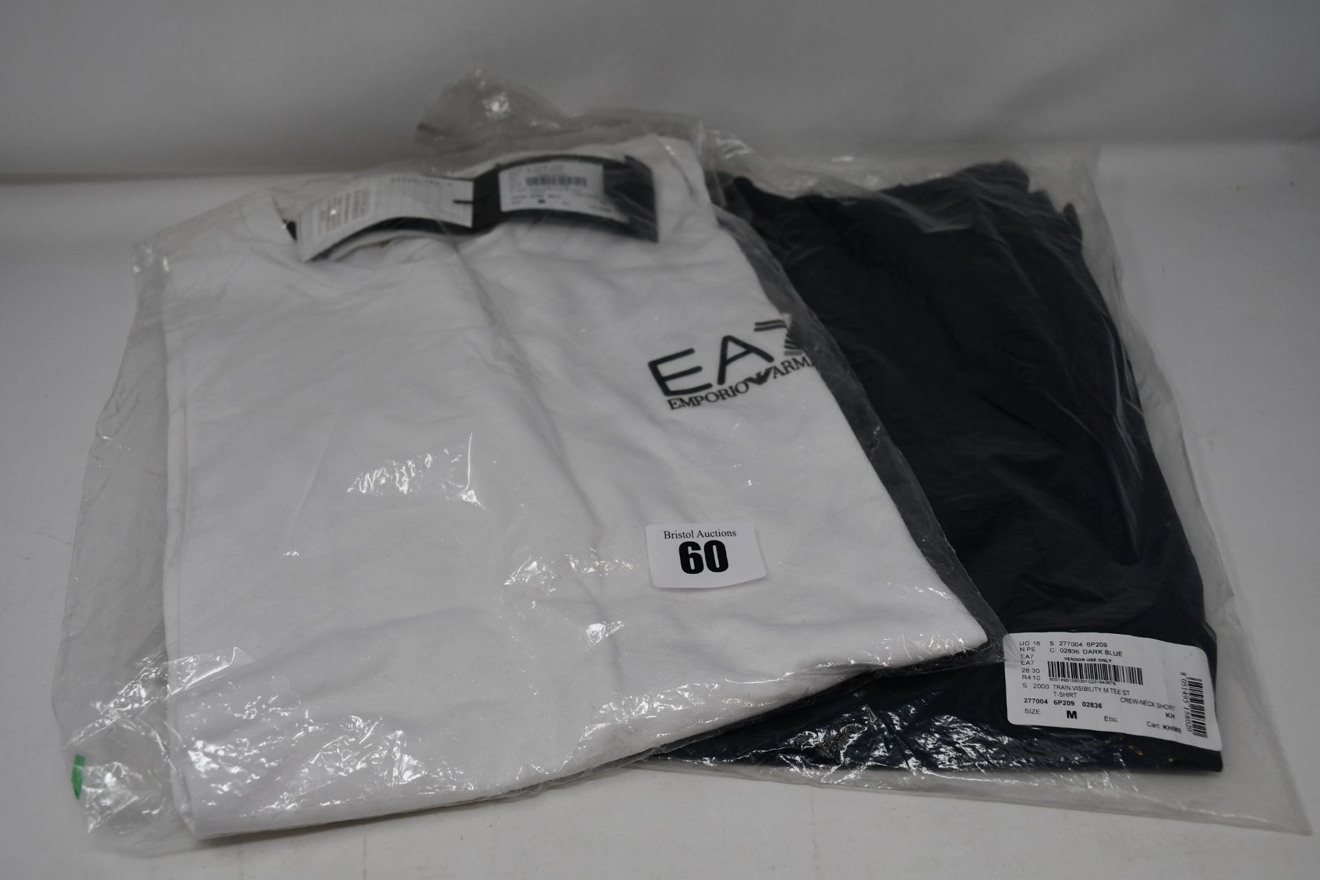 Two as new Emporio Armani EA7 T-shirts, one black and one white (Both M).