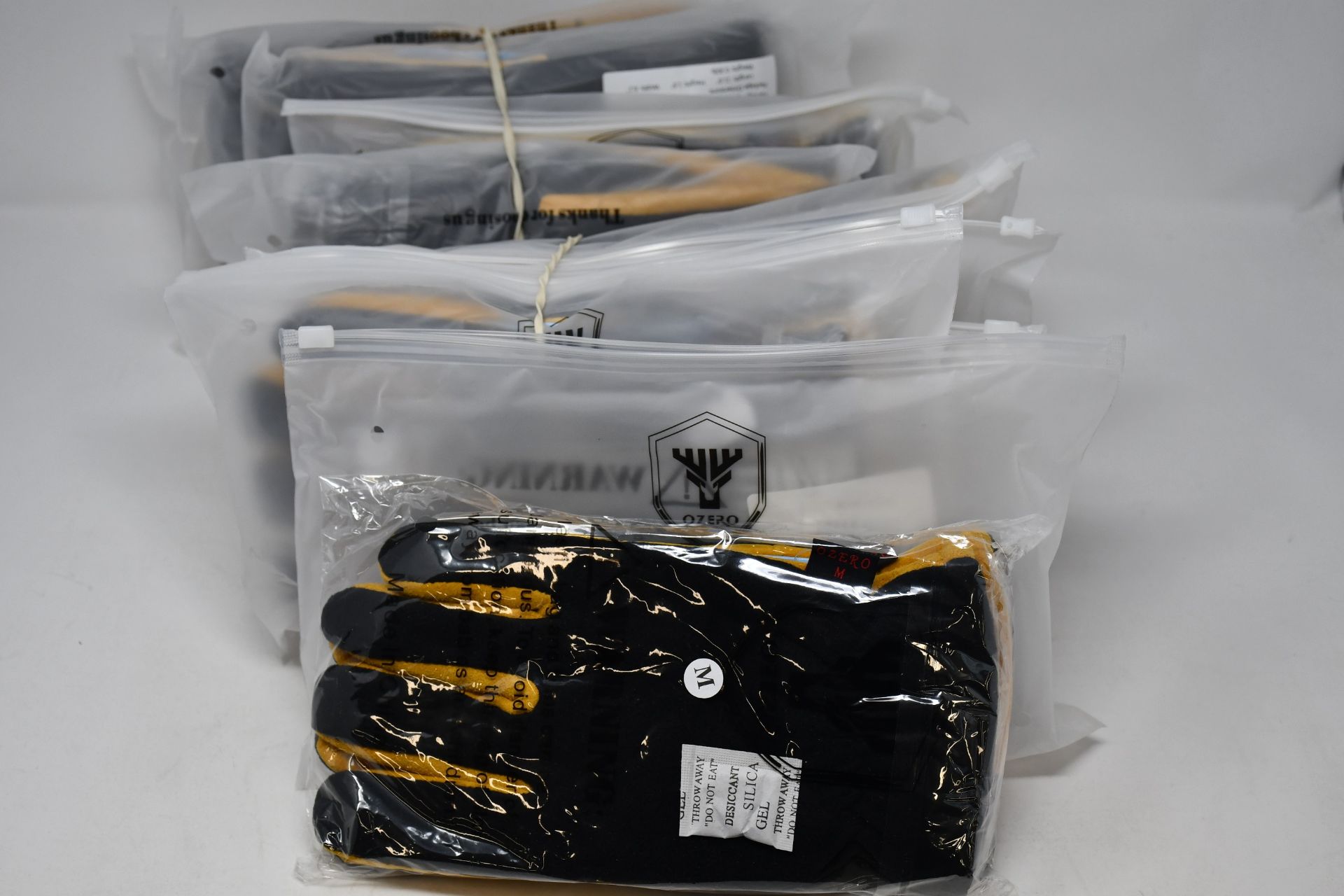 Ten pairs of as new Ozone leather gloves; deerskin suede palm, polar fleece back and heatlock