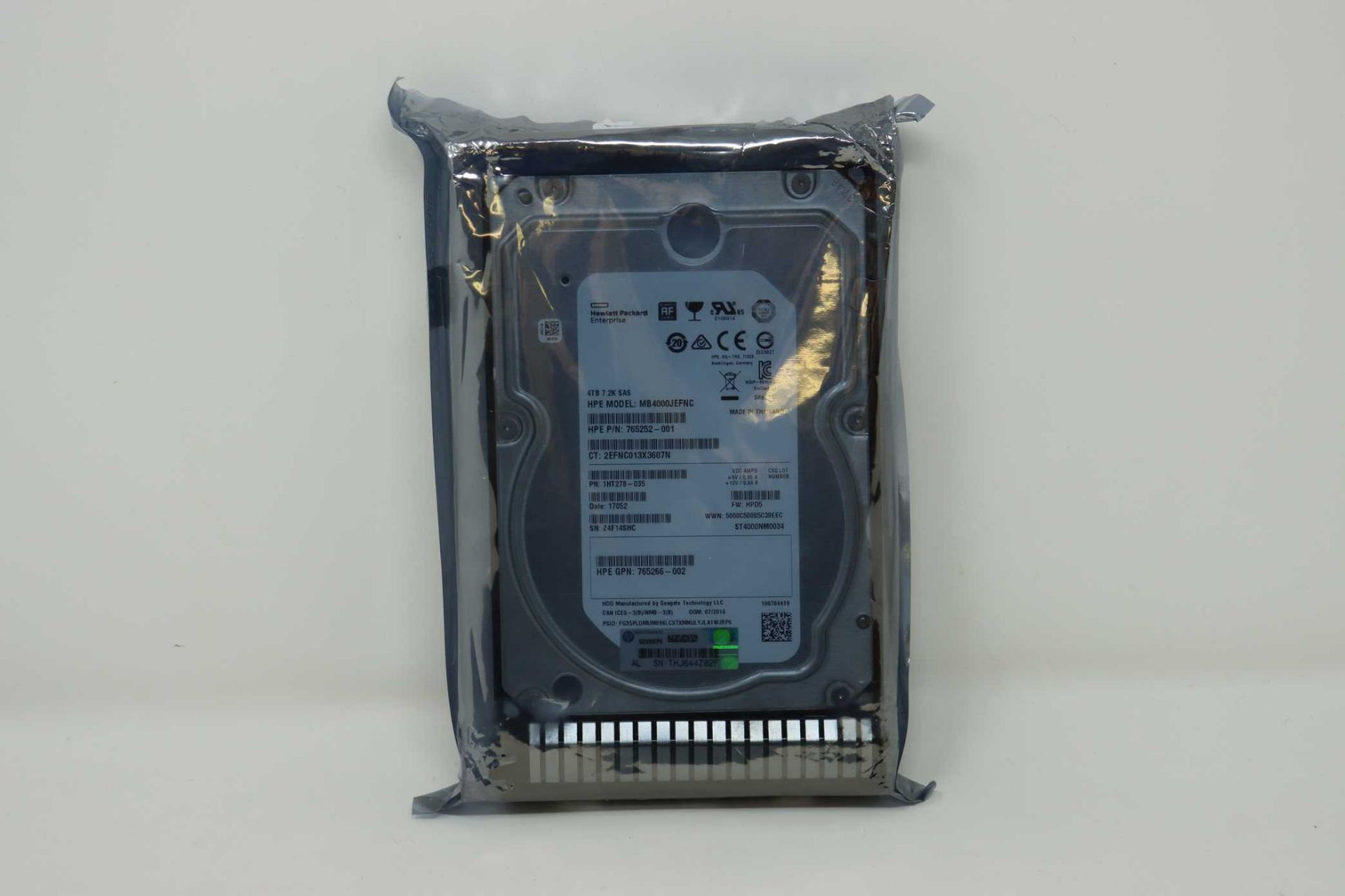A refurbished HPE 4TB 7.2K 3.5" SAS Hard Drive (GPN: 765266-002 Model: MB4000JEFNC) (Packaging
