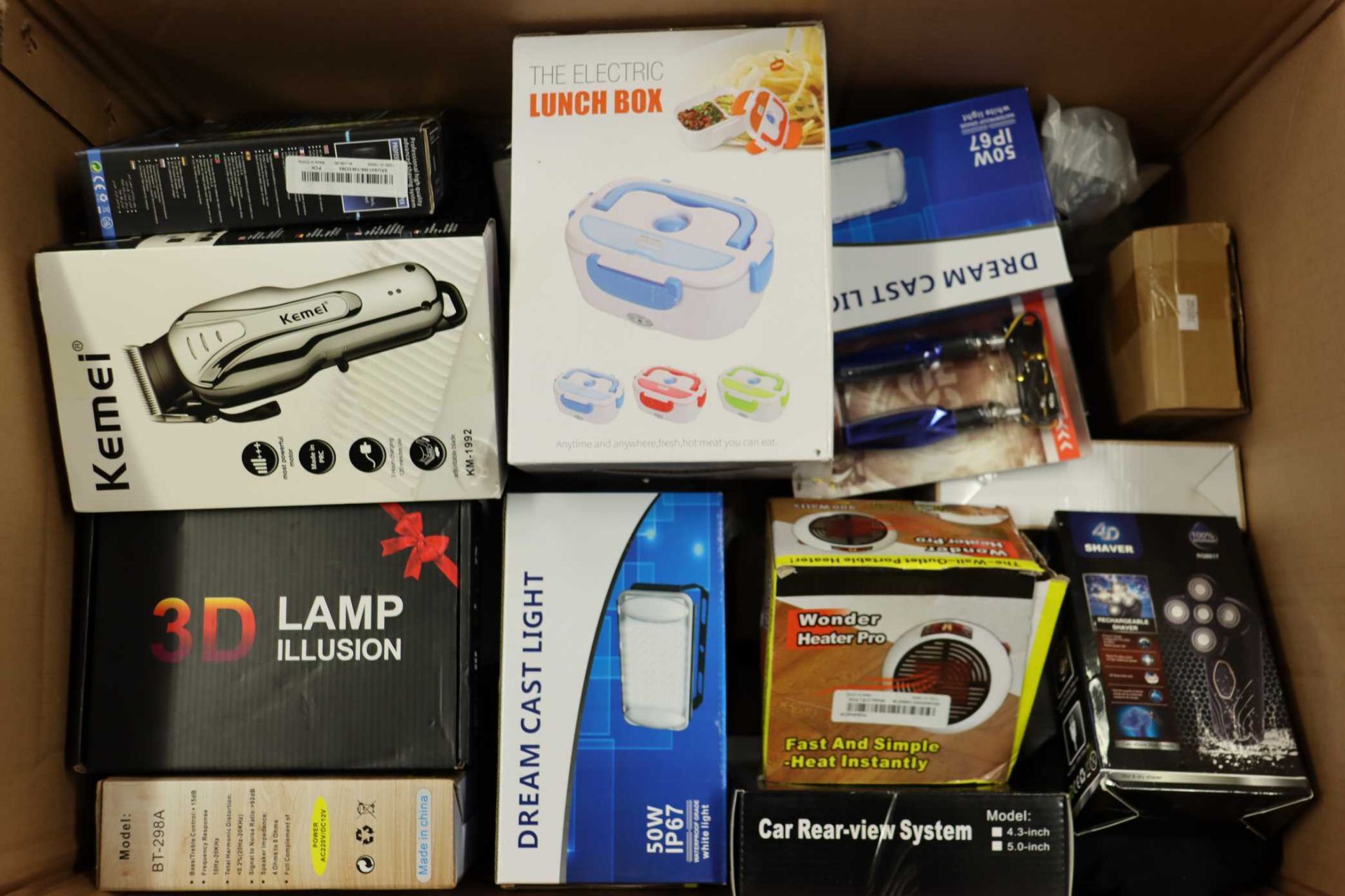 A box of assorted as new small electrical items and accessories.