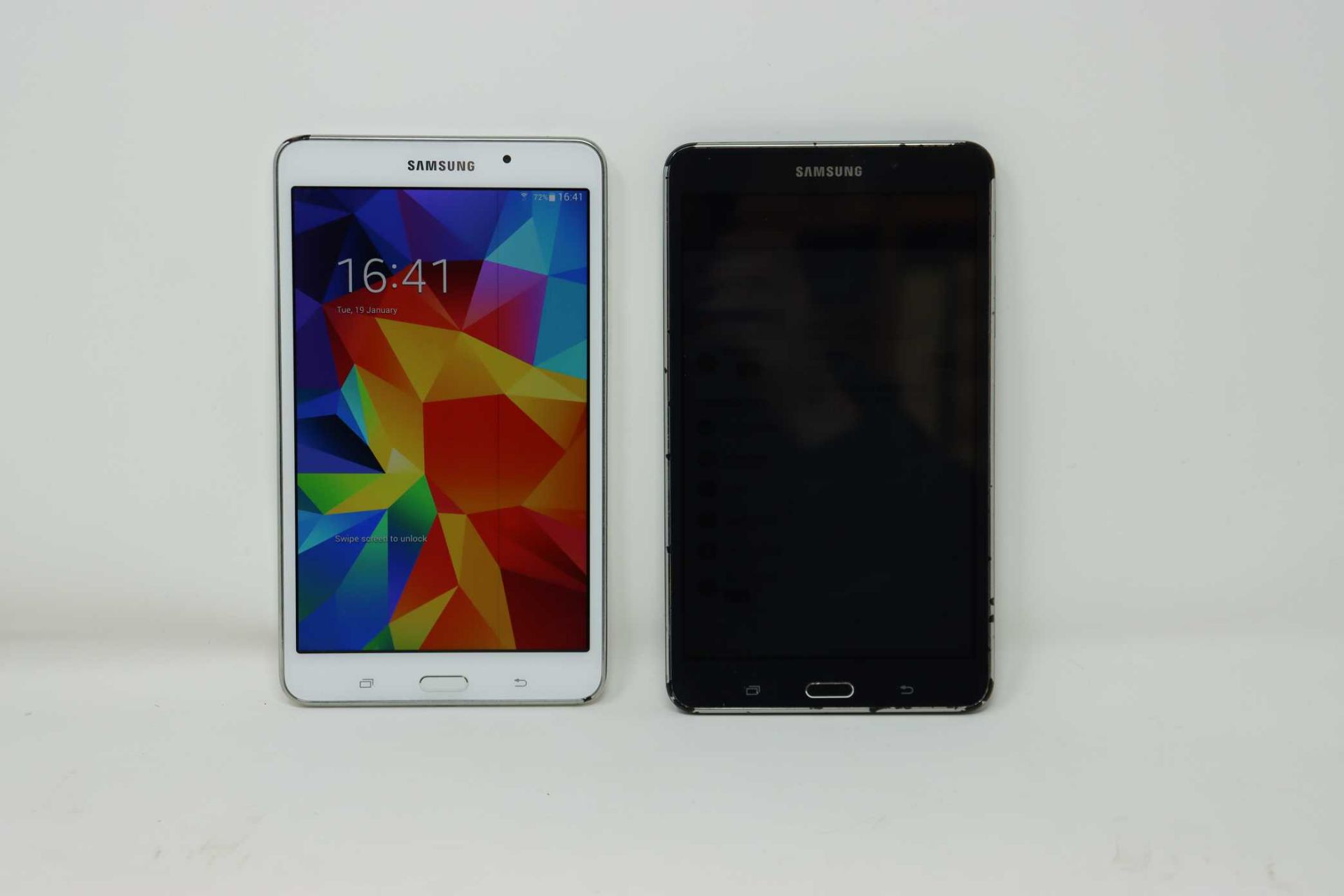 Two pre-owned Samsung Galaxy Tab 4 SM-T230 7" 8GB in Black (cosmetic damage to casing edges) and