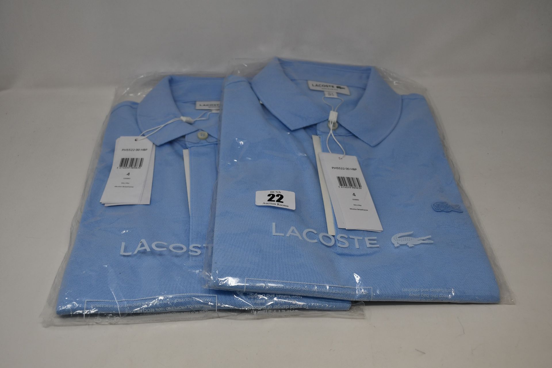 Two as new Lacoste polo shirts (US M).