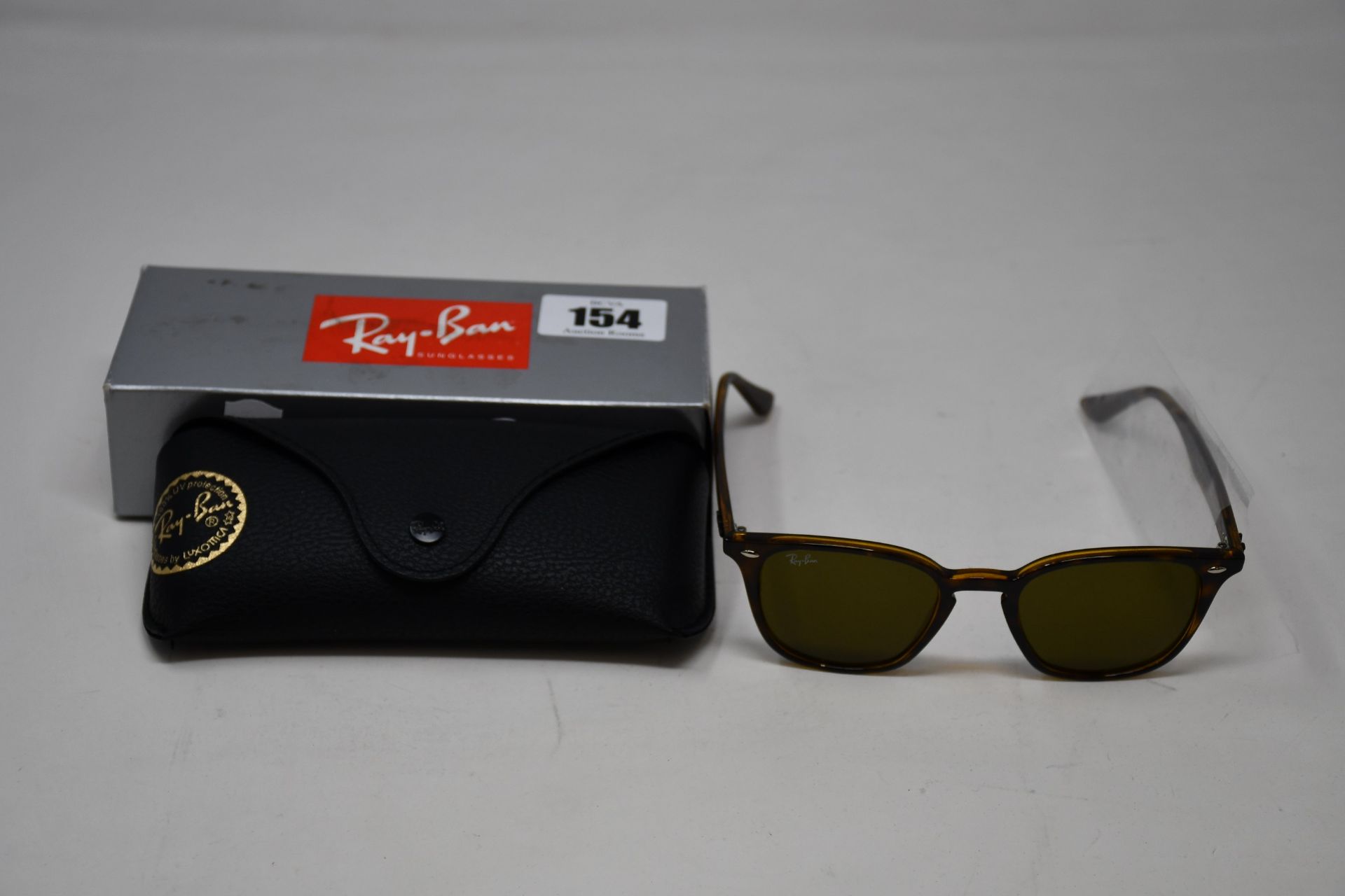 A pair of as new Ray Ban RB4258 sunglasses.