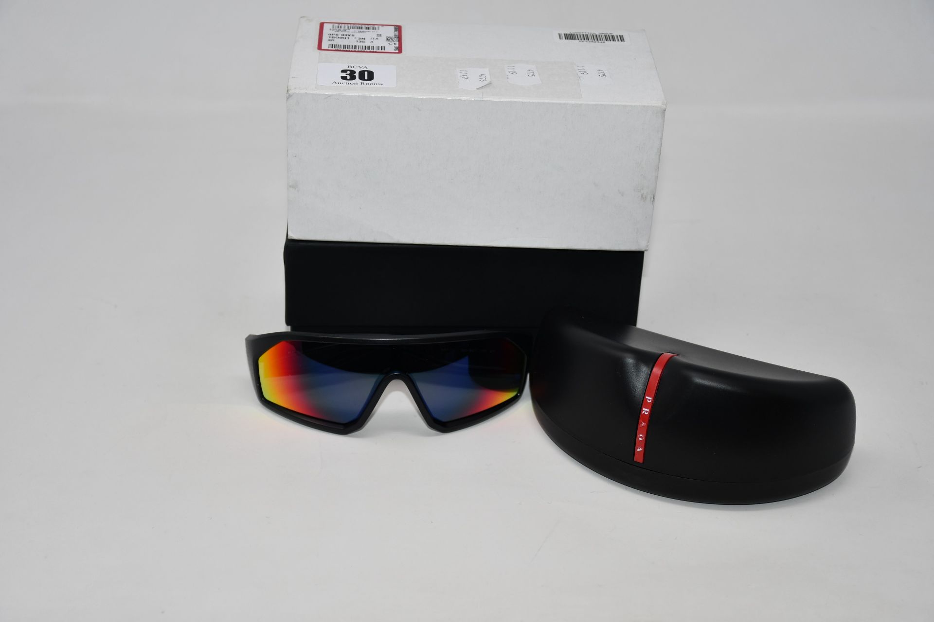 A pair of as new Prada Linea Rossa sunglasses.