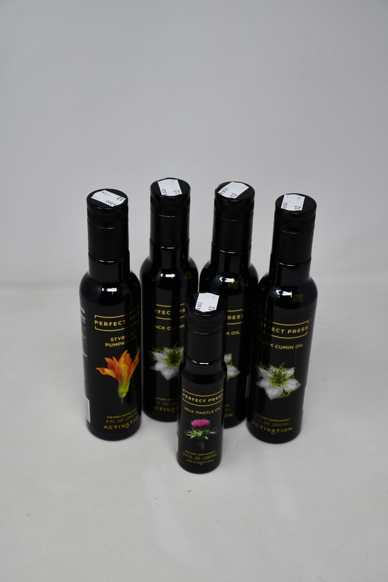 Three as new Perfect Press Black Cumin Oil (250ml), an as new Perfect Press Styrian Pumpkin Oil (