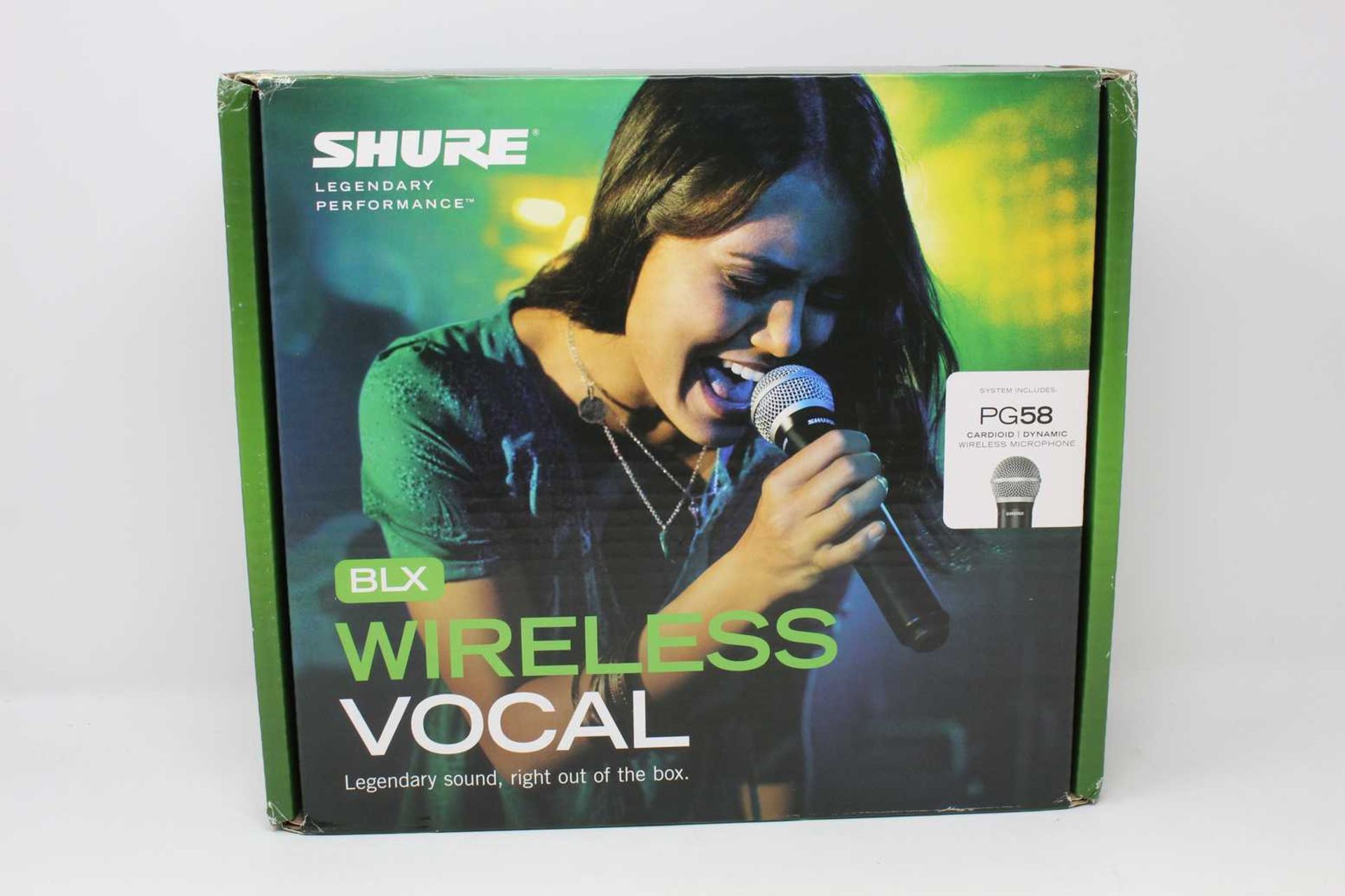 A boxed as new Shure BLX24 PG58 Wireless Microphone and Transmitter (Box opened).