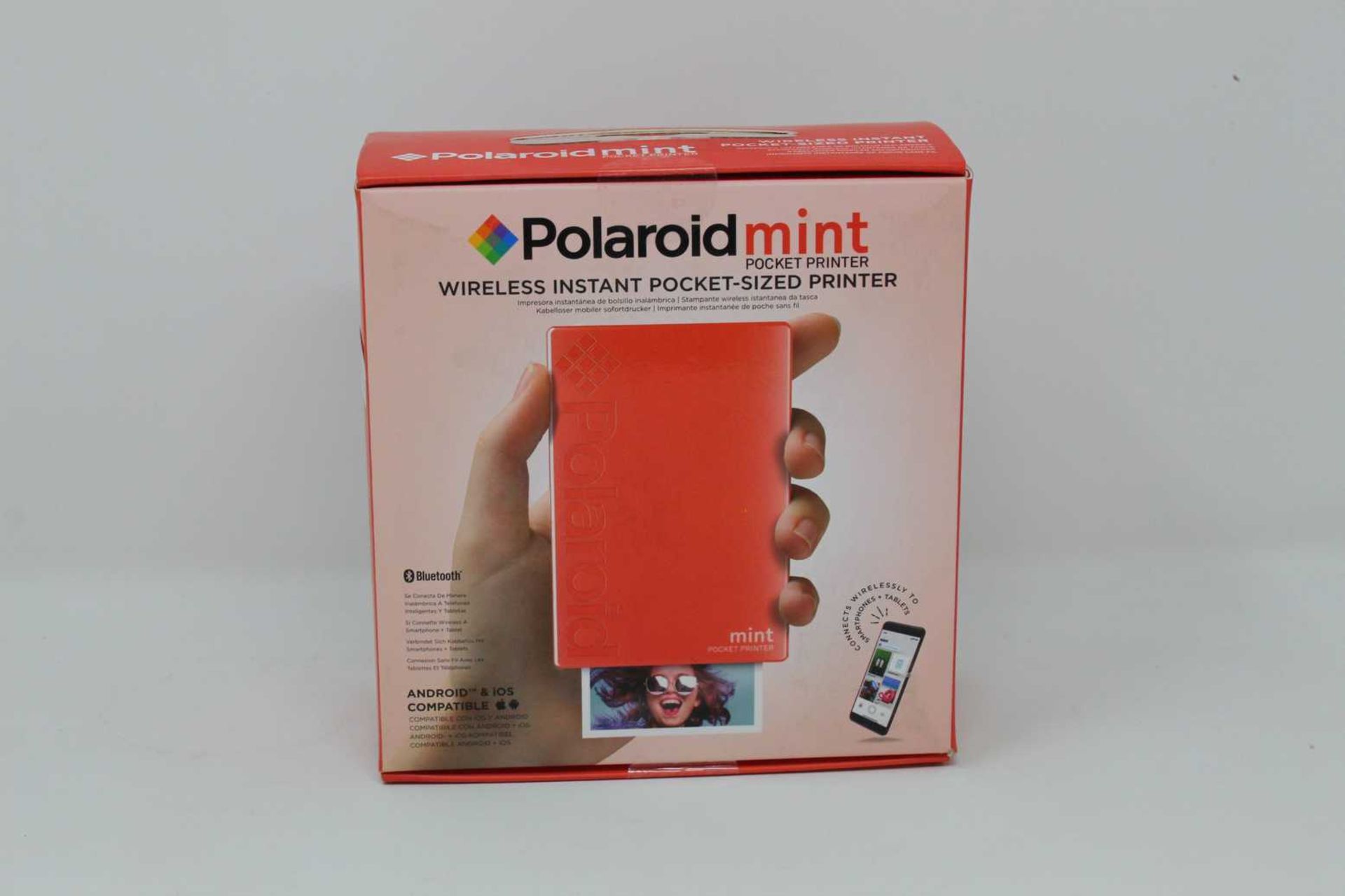 A boxed as new Polaroid Mint Wireless Instant Pocket Printer in Red (M/N: POLMP02R) (Box sealed).