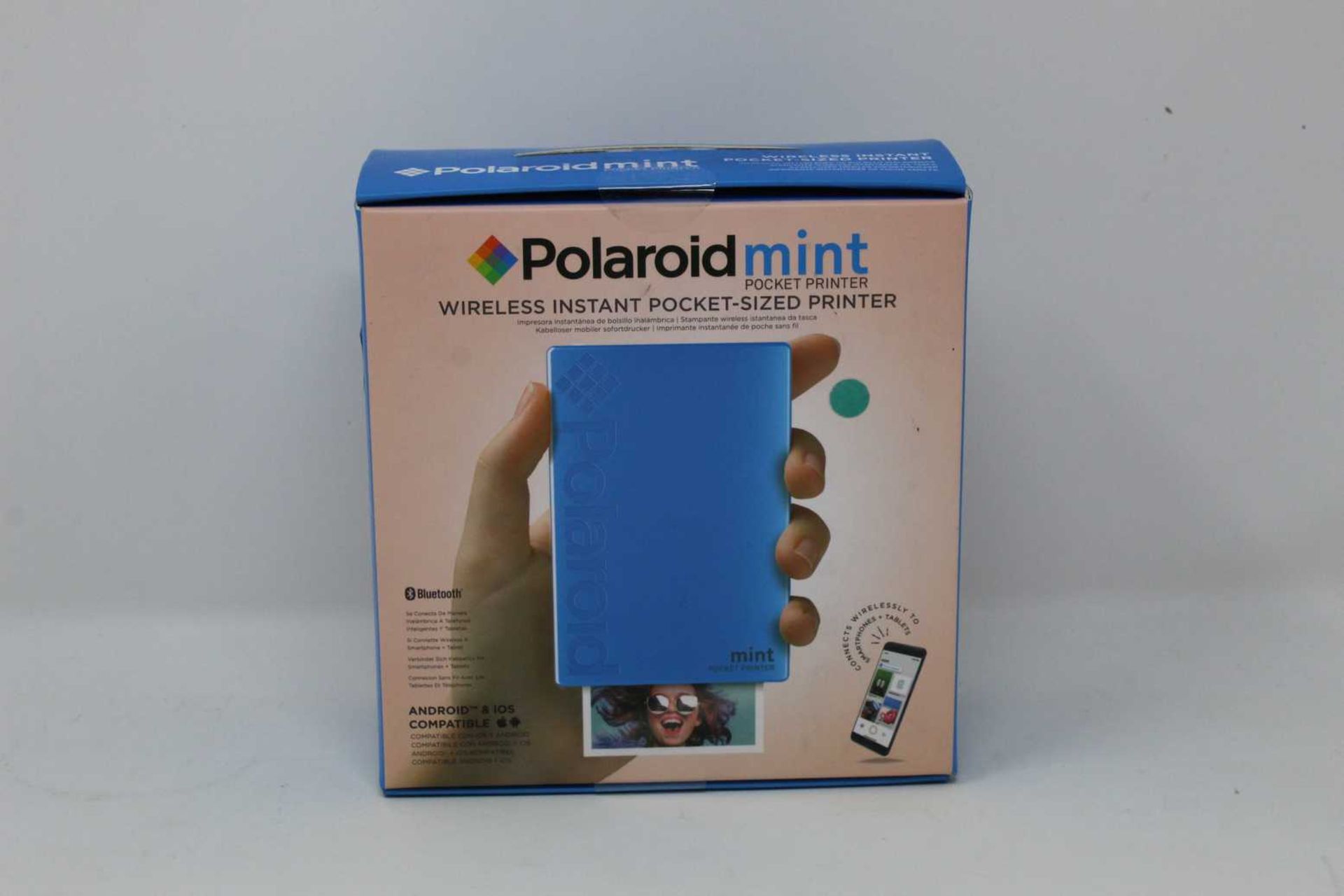 A boxed as new Polaroid Mint Wireless Instant Pocket Printer in Blue (M/N: POLMP02BL) (Box sealed).