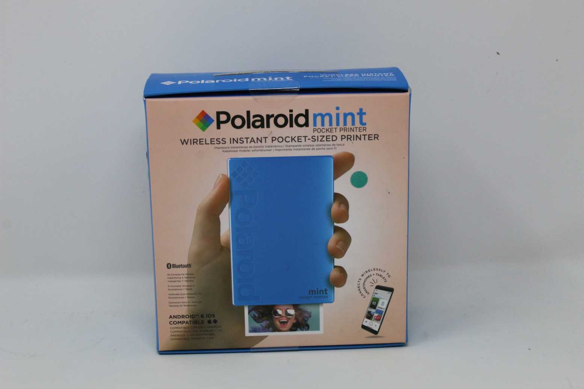A boxed as new Polaroid Mint Wireless Instant Pocket Printer in Blue (M/N: POLMP02BL) (Box sealed).