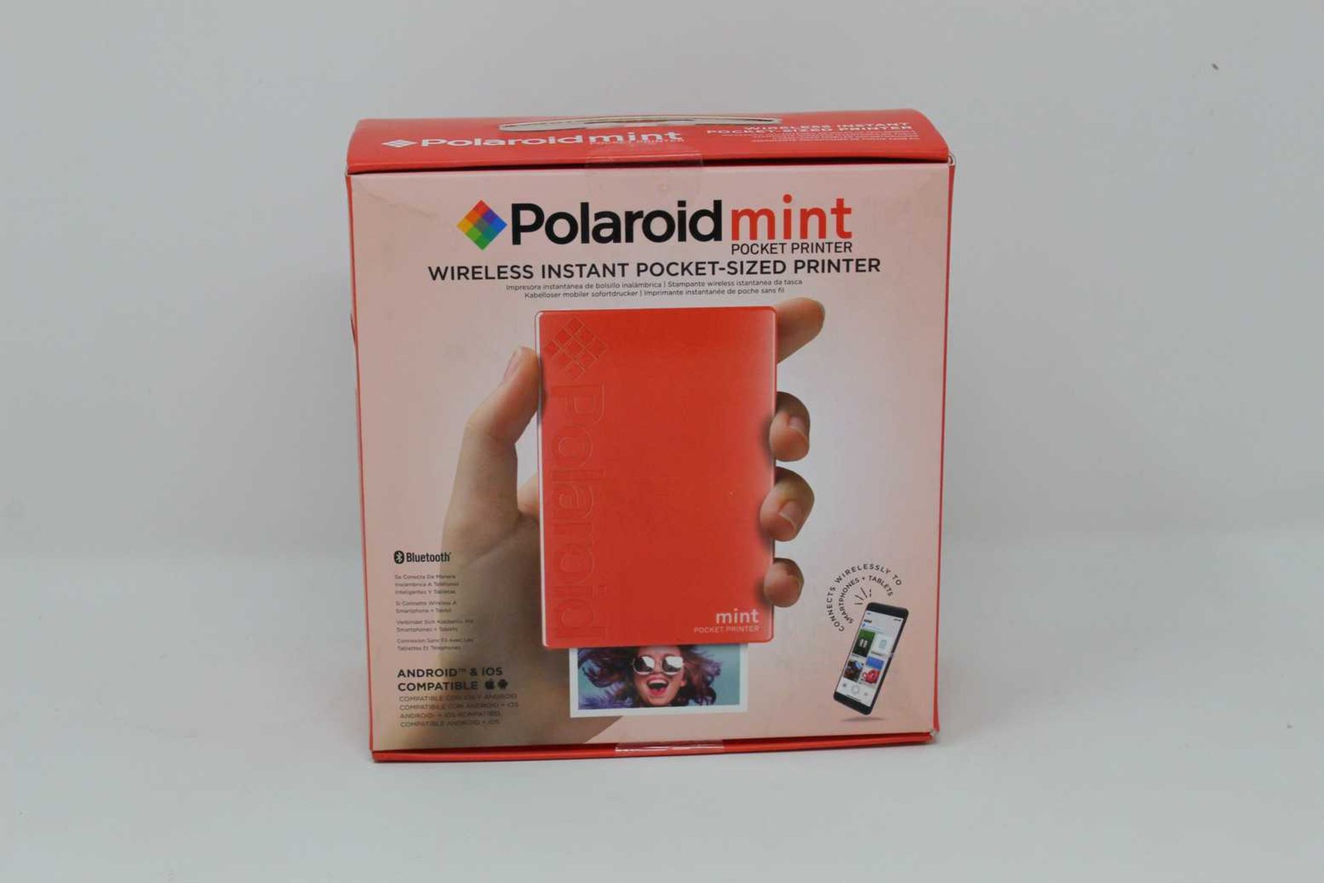 A boxed as new Polaroid Mint Wireless Instant Pocket Printer in Red (M/N: POLMP02R) (Box sealed).