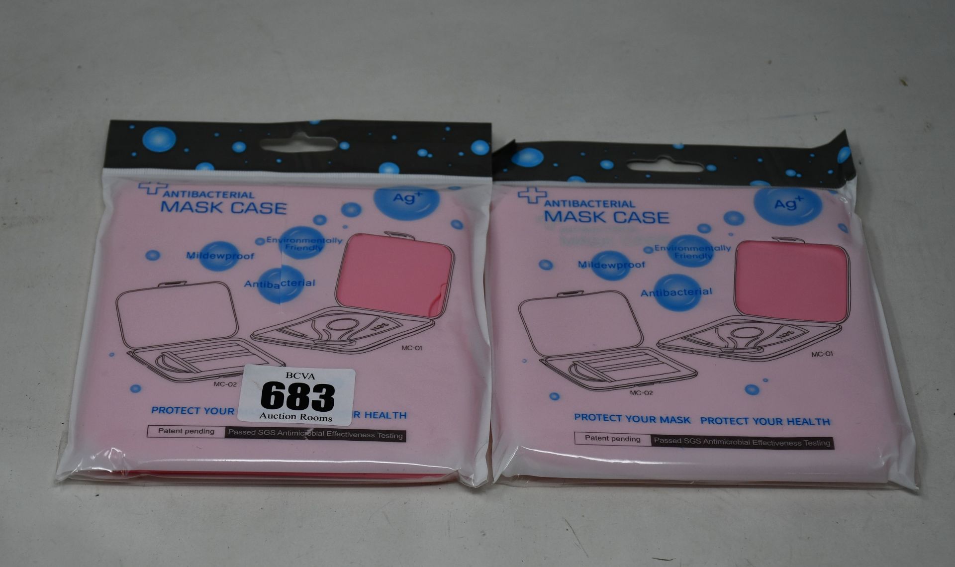 Three hundred boxed as new Antibacterial Face Mask Cases in pink.