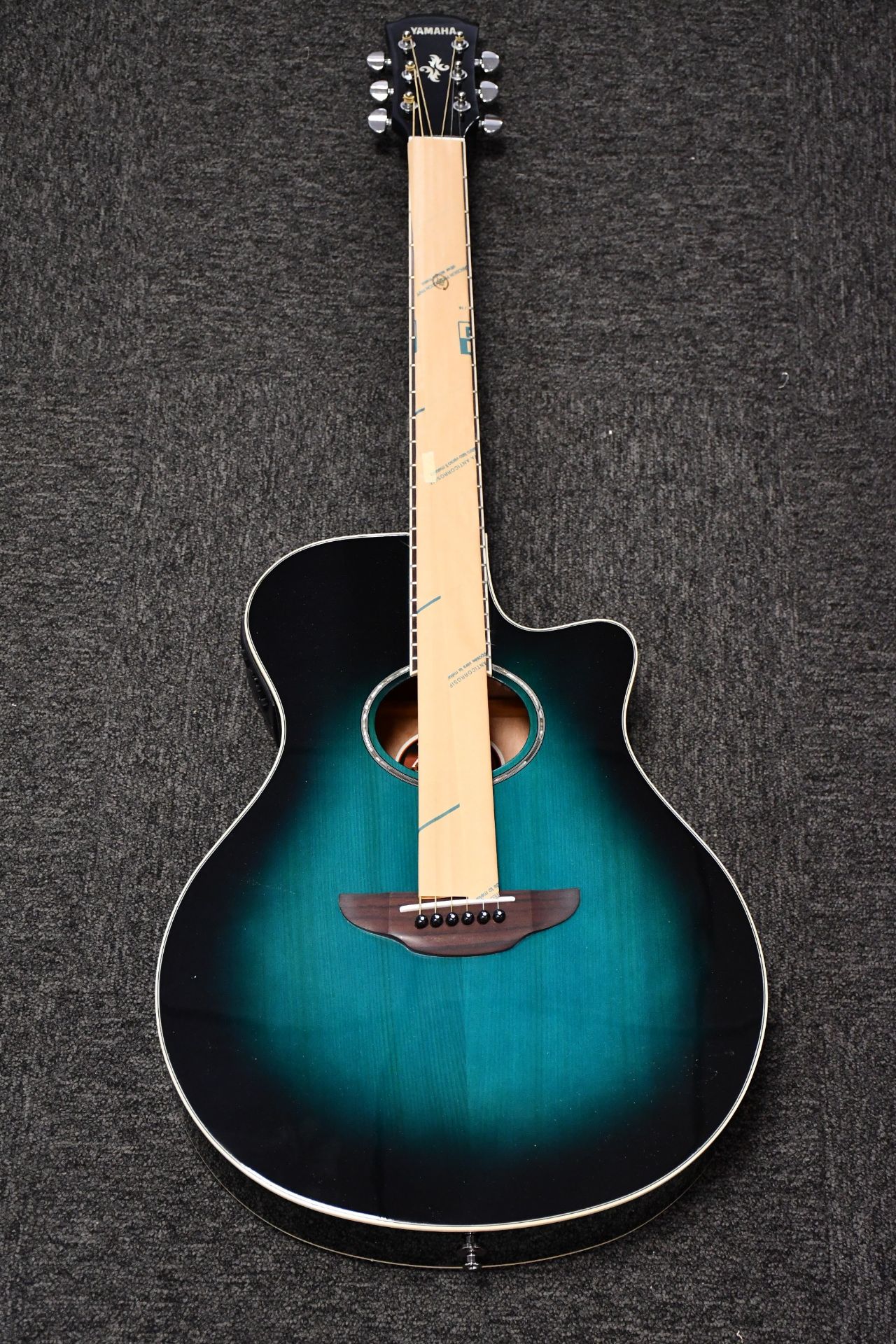 A boxed as new Yamaha APX600 electro acoustic guitar in oriental blue.