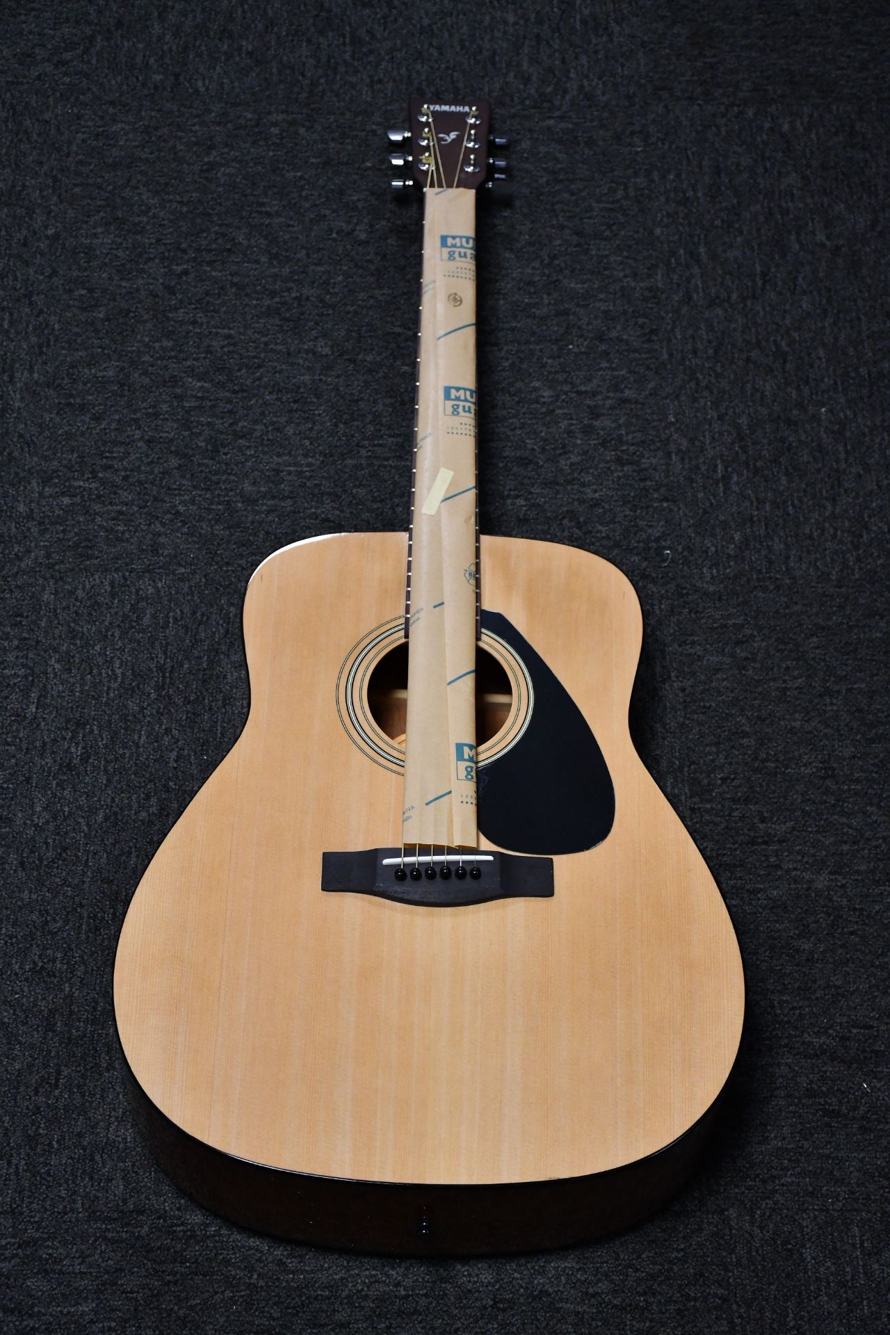 A boxed as new Yamaha F310 acoustic guitar.