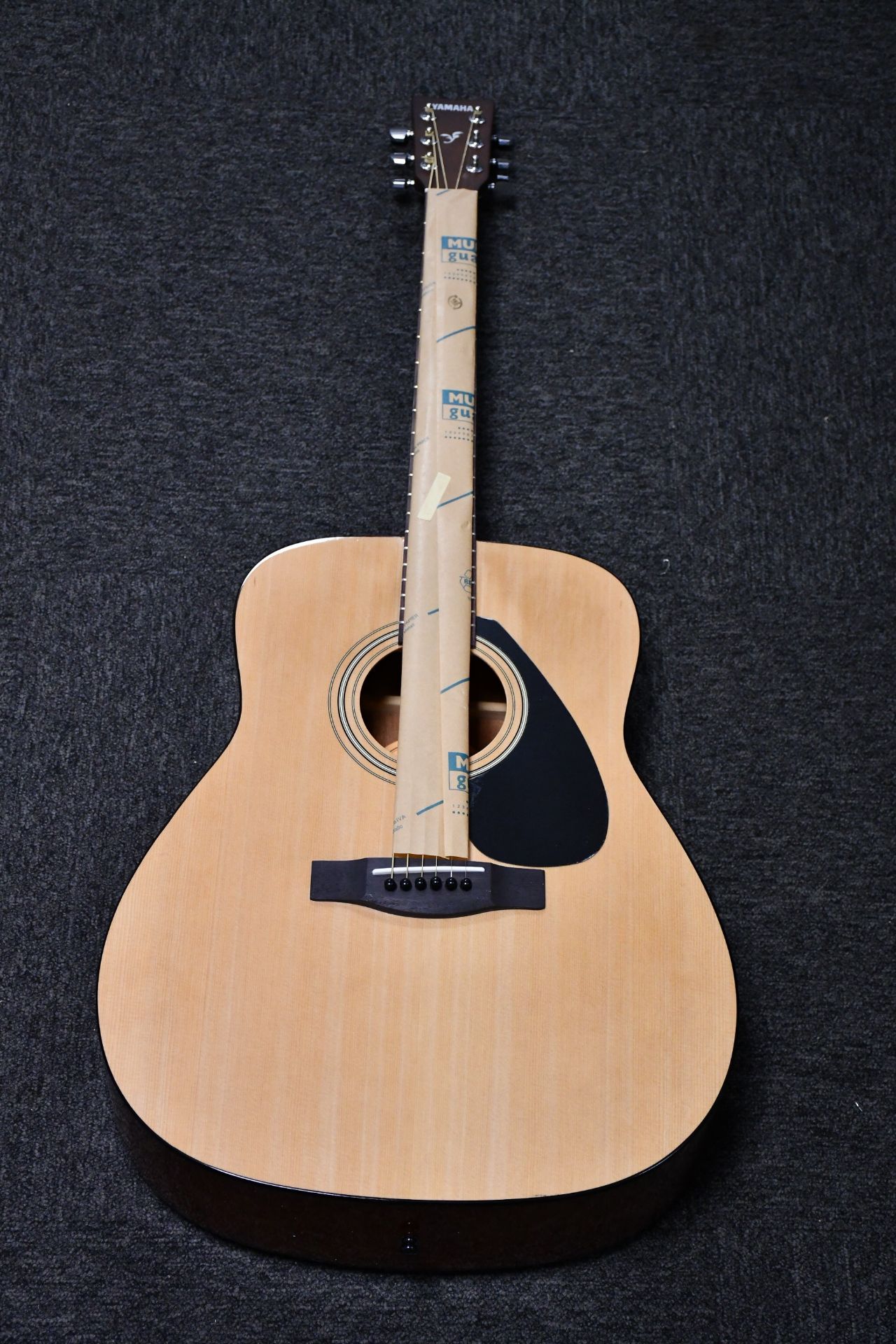 A boxed as new Yamaha F310 acoustic guitar.