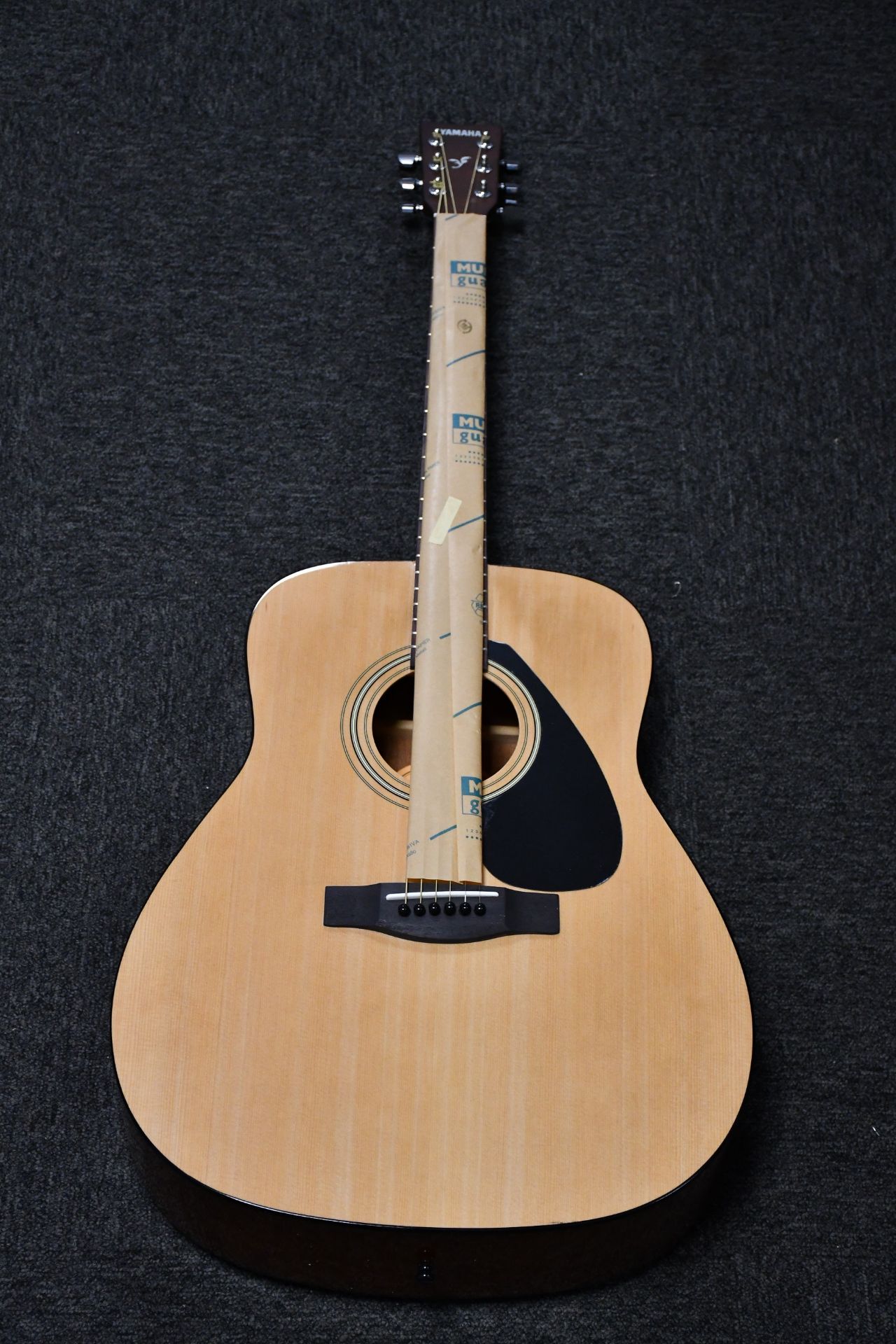 A boxed as new Yamaha F310 acoustic guitar.