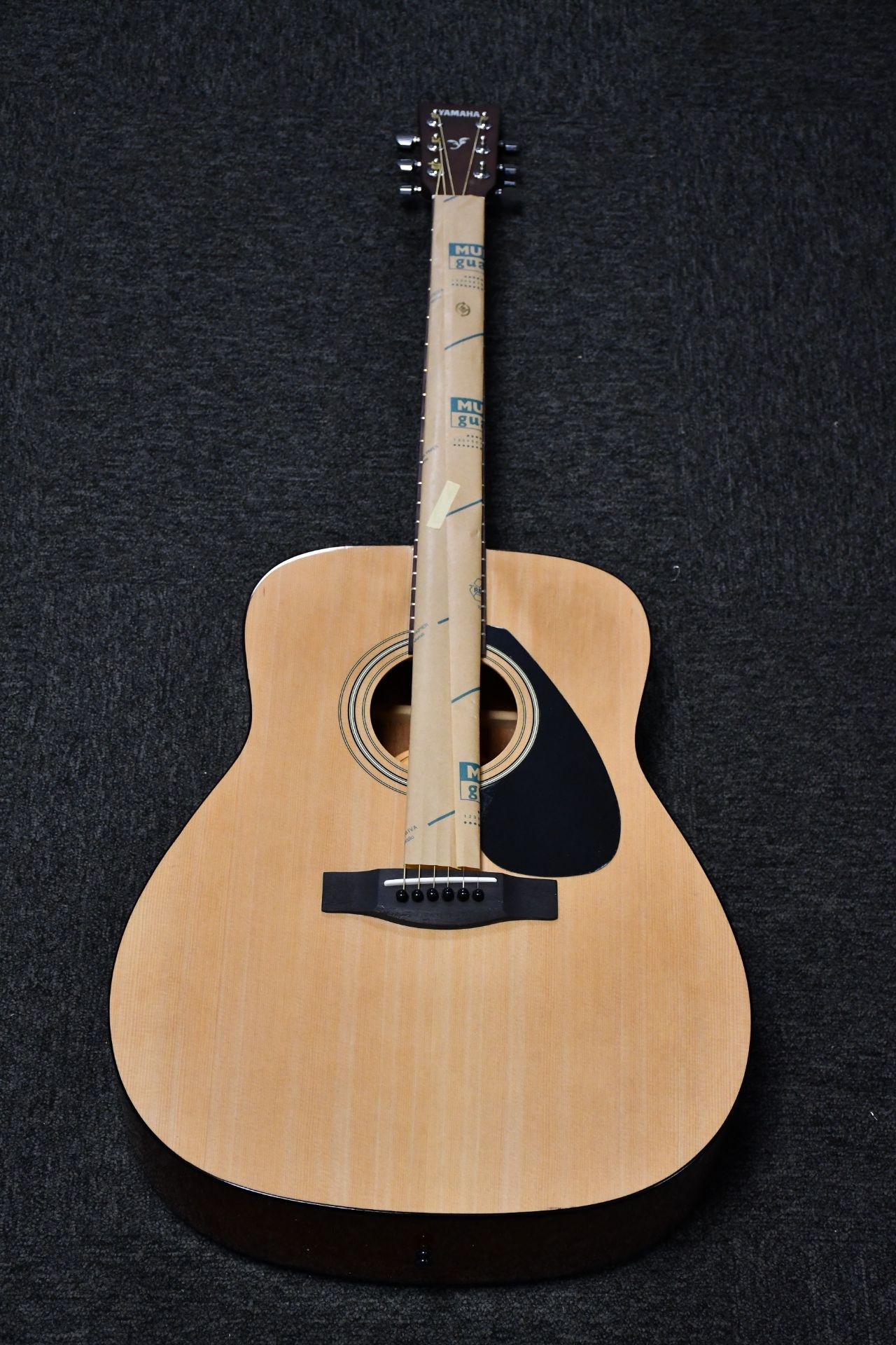 A boxed as new Yamaha F310 acoustic guitar.