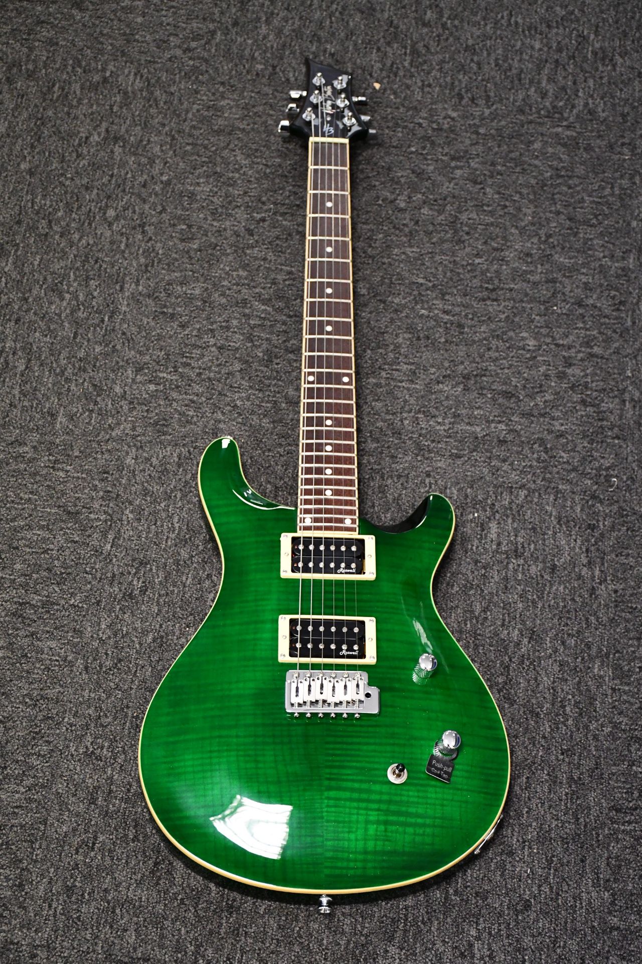 A boxed as new Harley Benton CST-24T Emerald Flame electric guitar.