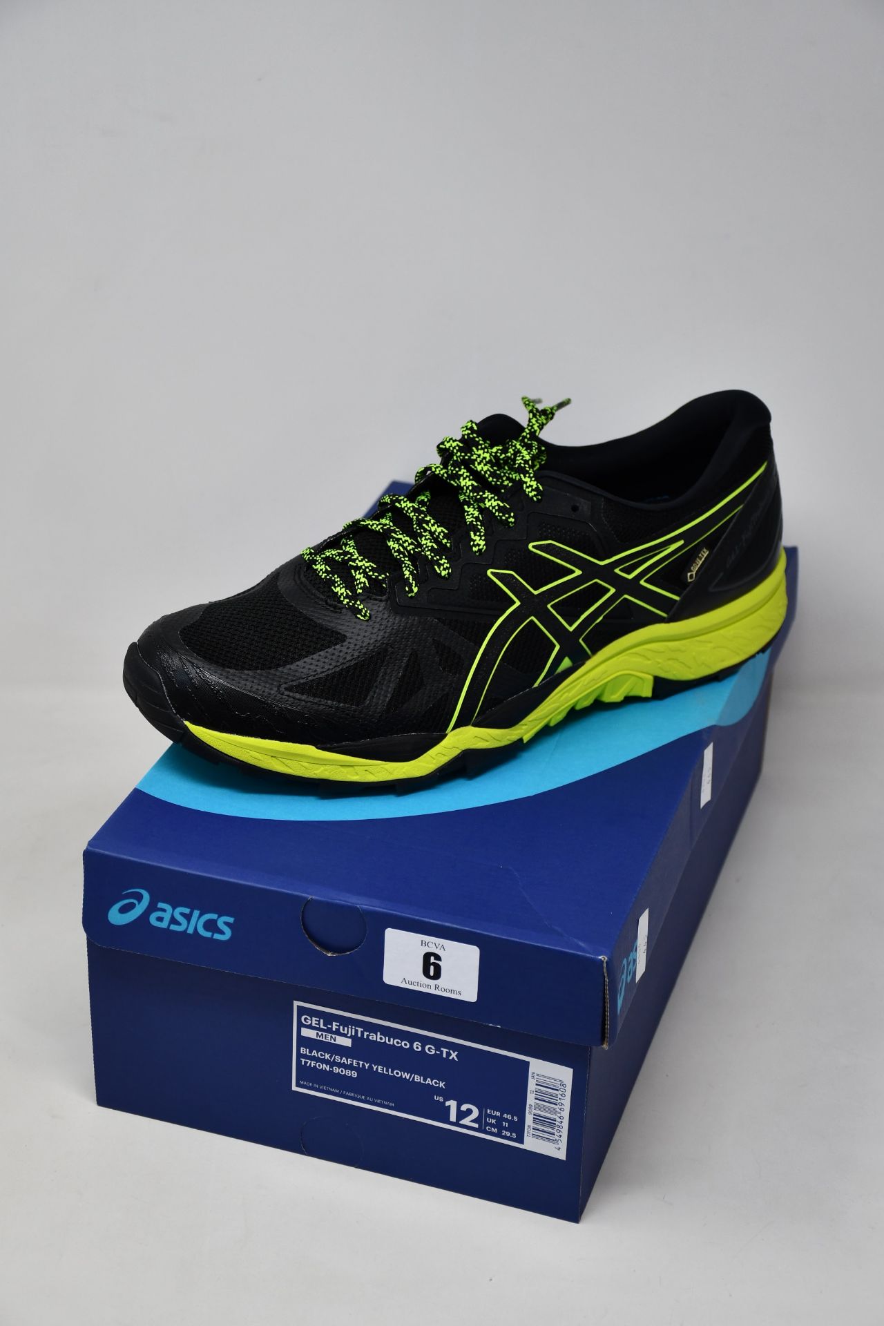 A pair of as new Asics Gel-FujiTrabuco 6 G-TX trainers (UK 11).