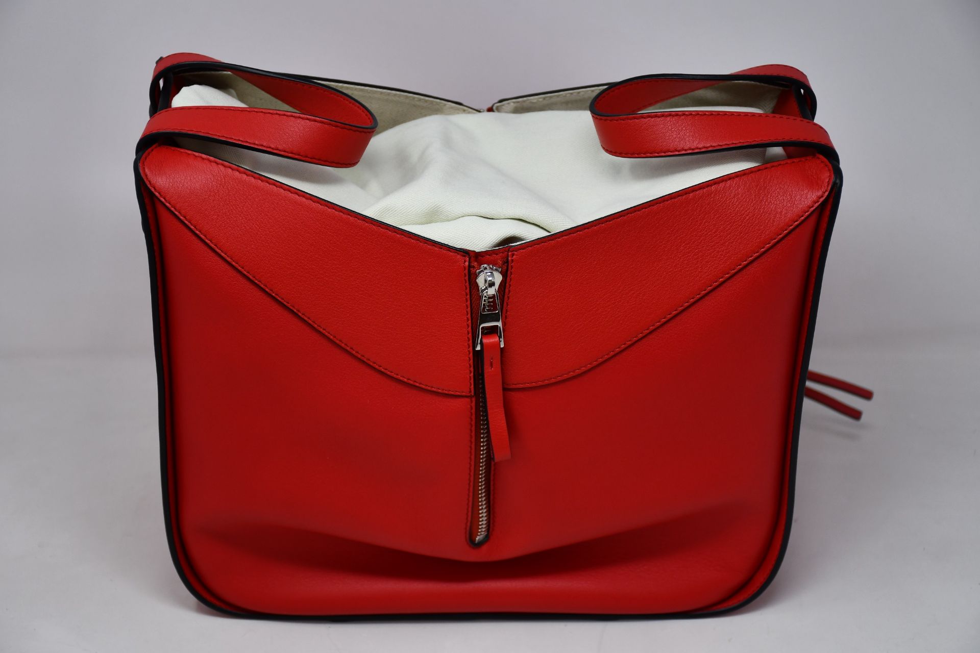 An as new Loewe small Hammock bag in red (RRP £1850).