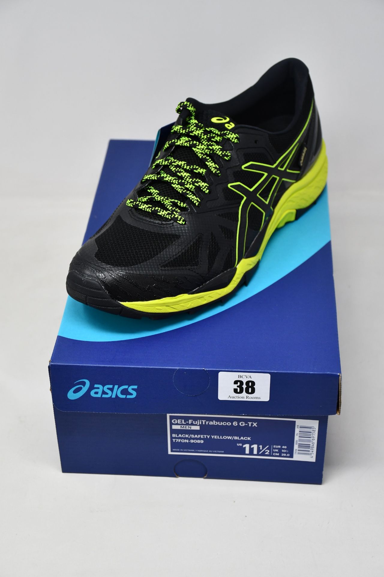 A pair of as new Asics Gel-FujiTrabuco 6 G-TX trainers (UK 10.5).