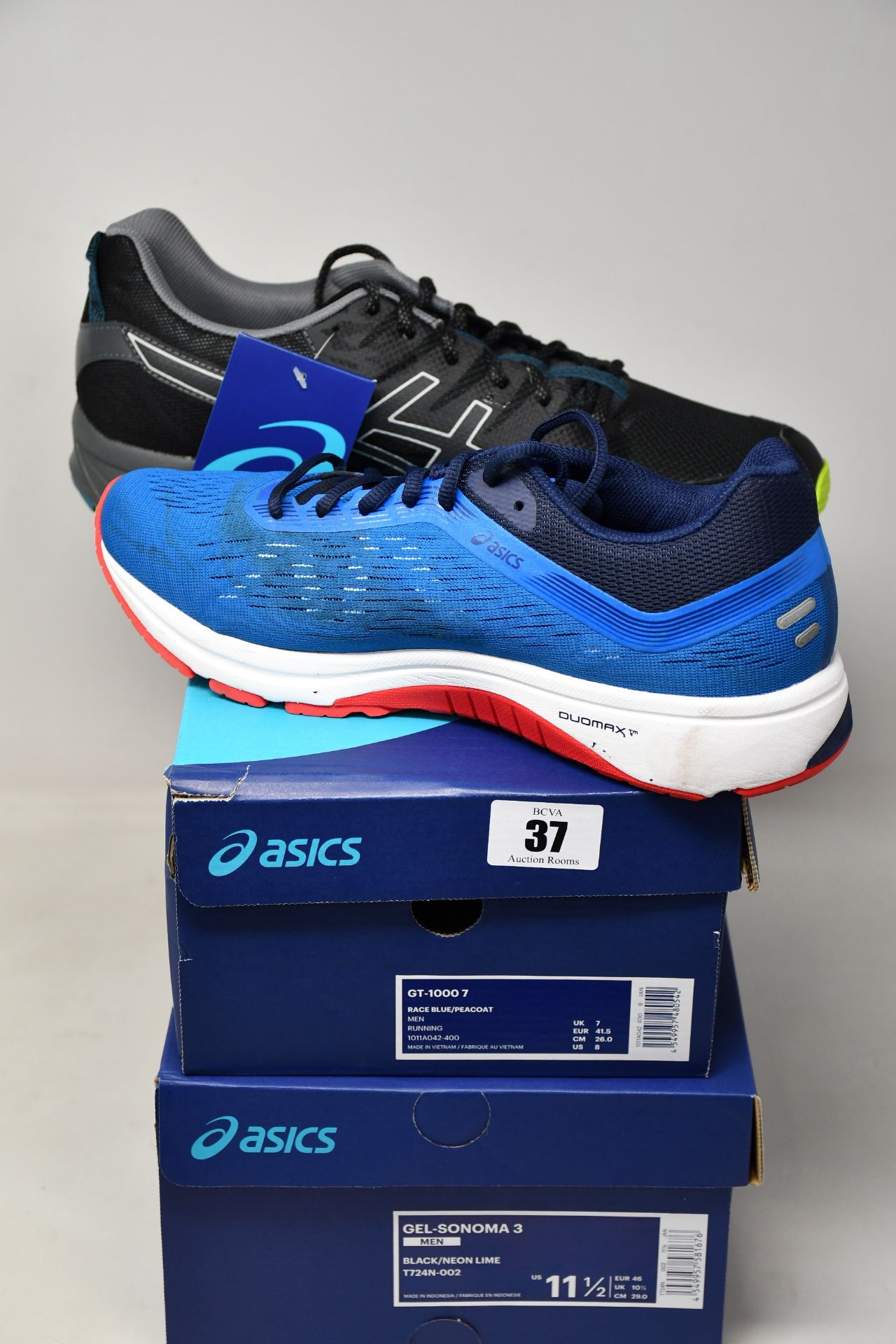 Two pairs of as new Asics trainers; GT-1000 7 (UK 7) (As new but has some marks on the back of right