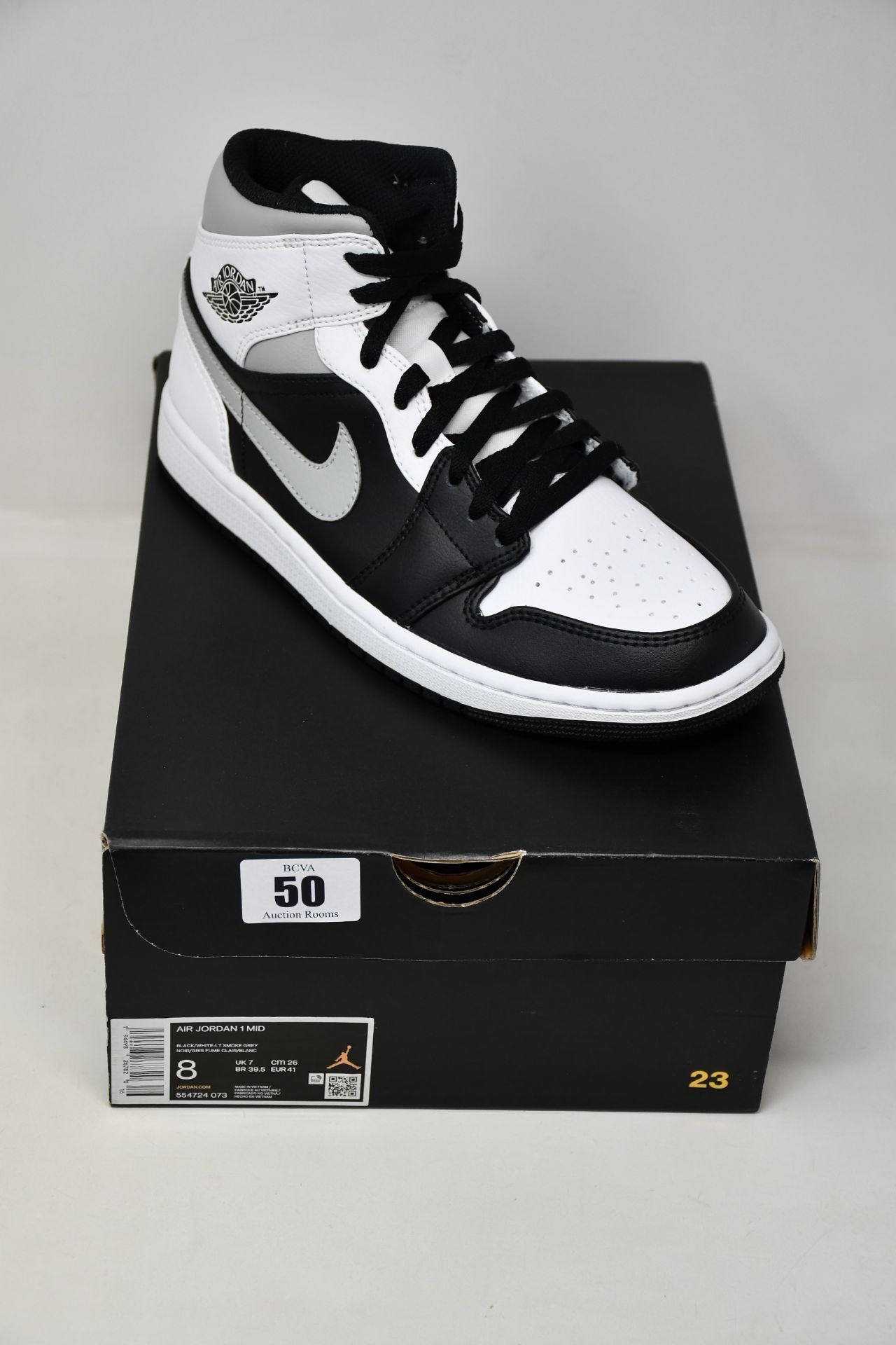 A pair of as new Nike Air Jordan Mid (UK 7).