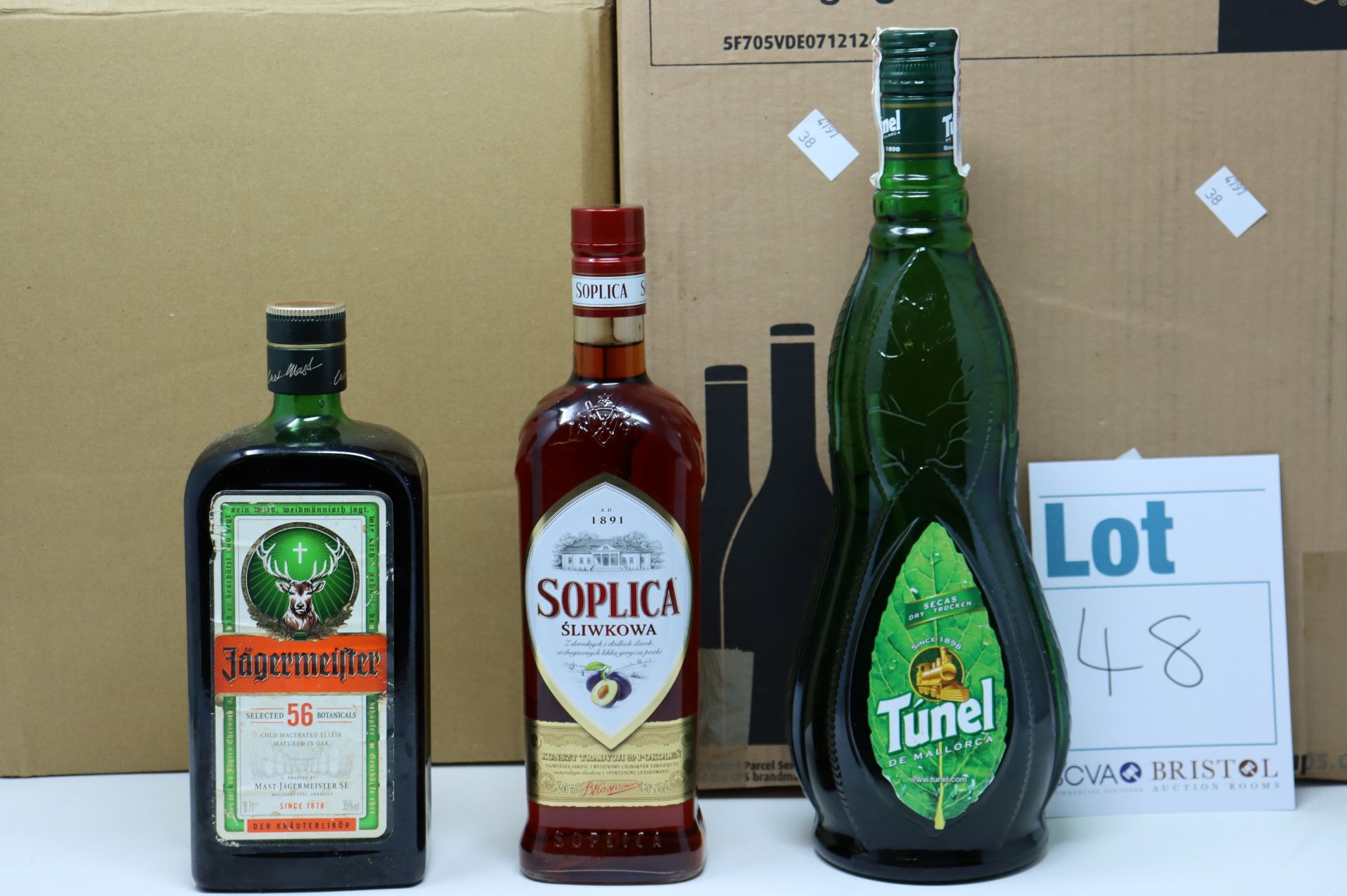 A quantity of assorted spirits and related items to include Trevethan passion fruit and orange