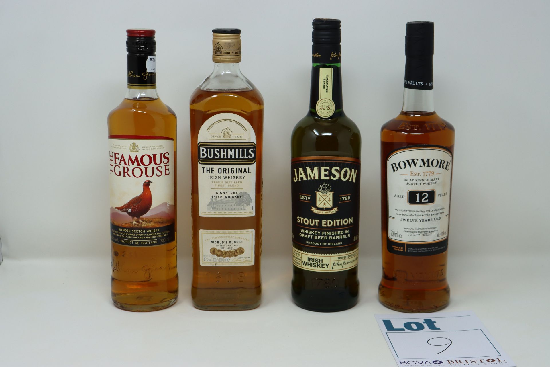 Five bottles of miscellaneous whiskeys to include The Famous Grouse, Bushmills The Original and