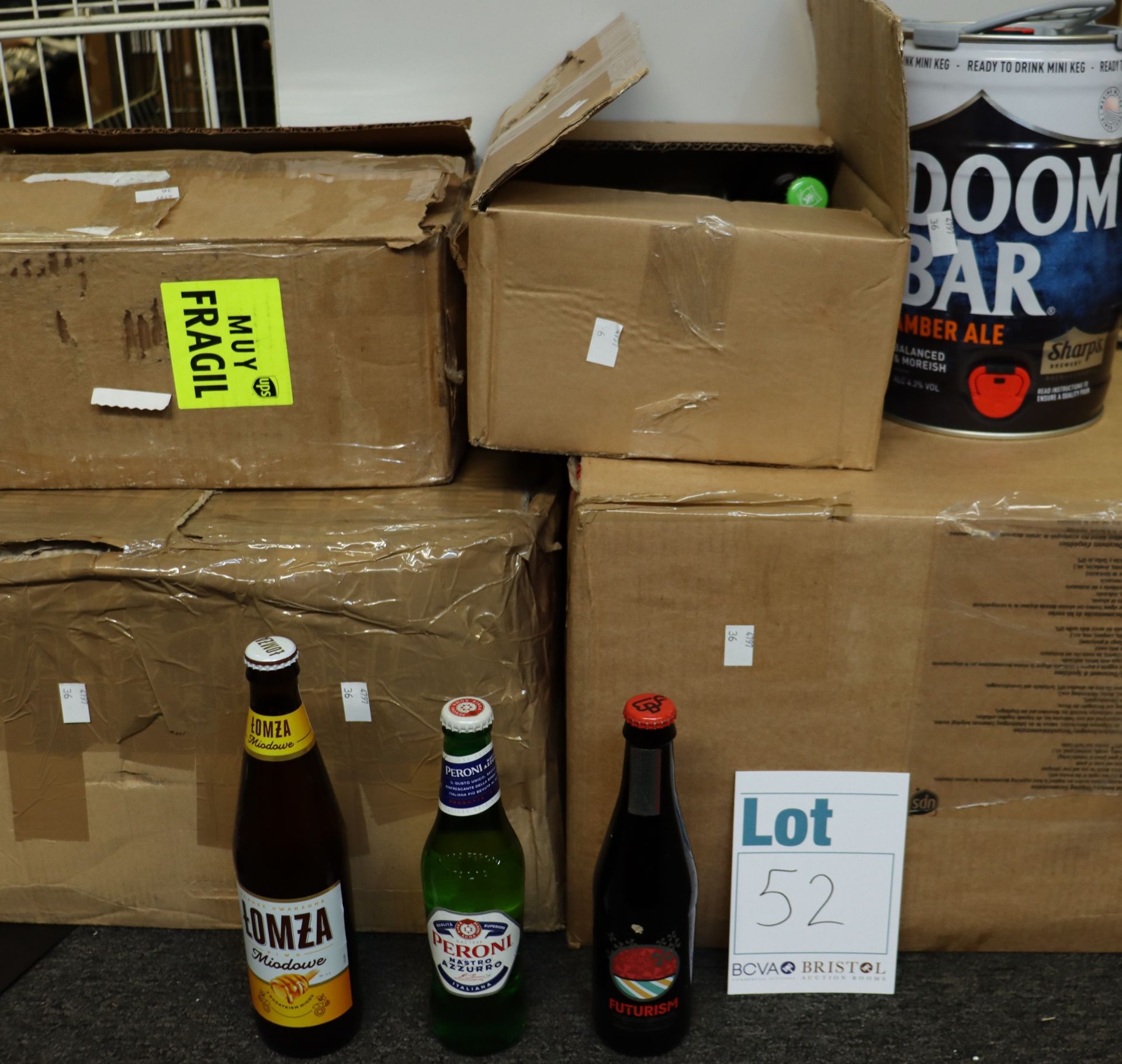 A large quantity of assorted beers and related items to include a Doom Bar mini keg, Lech, Peroni,