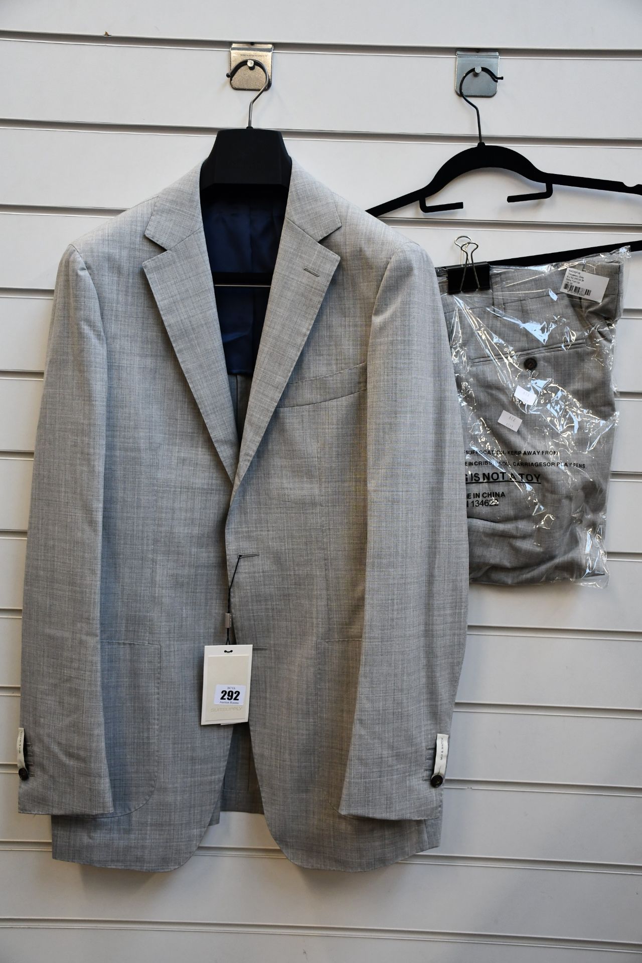 An as new Suit Supply suit in light grey (Jacket 98/40L - RRP £249, trousers EU 52/UK 32 - RRP £