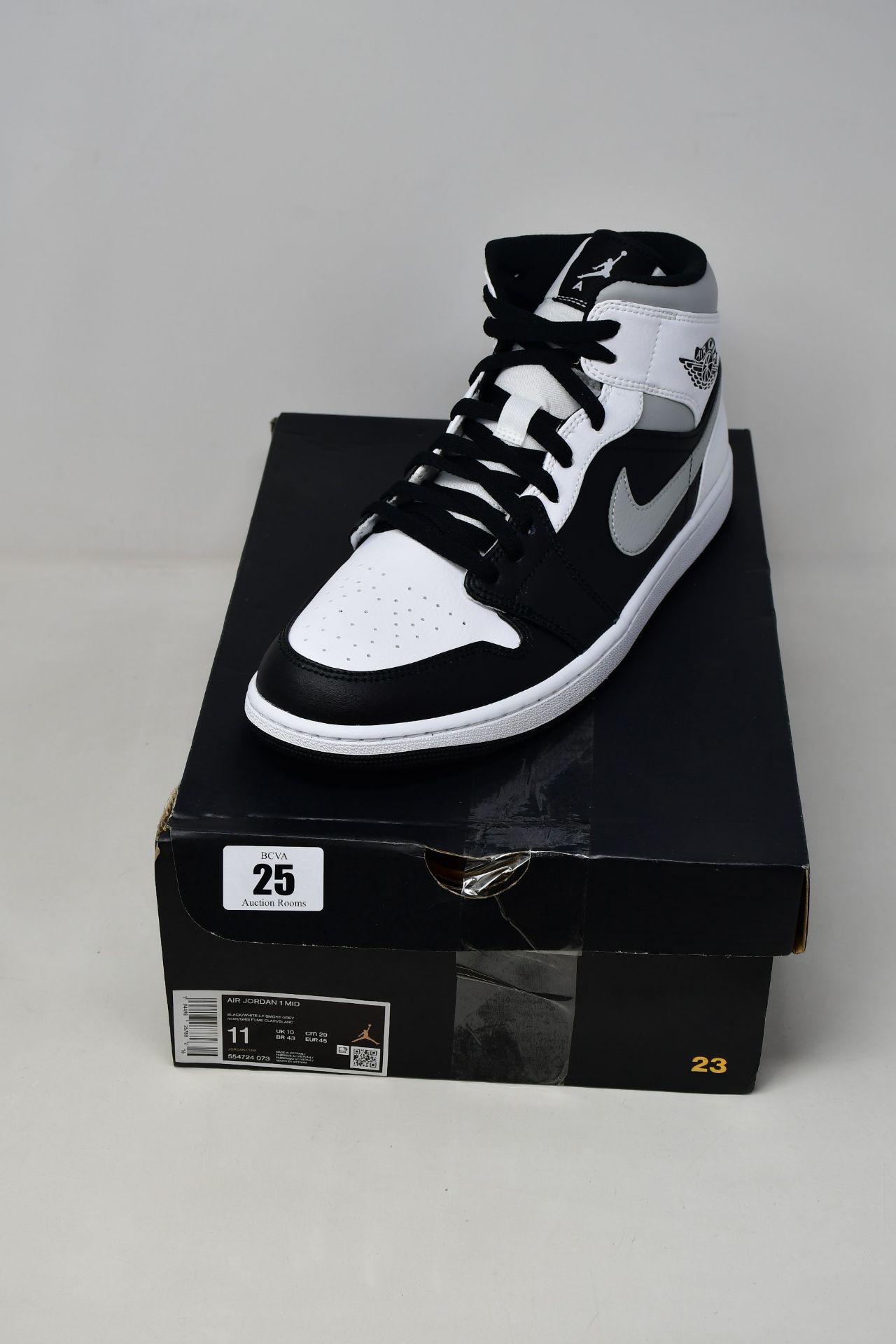 A pair of as new Nike Air Jordan 1 Mid sneakers (UK 10).