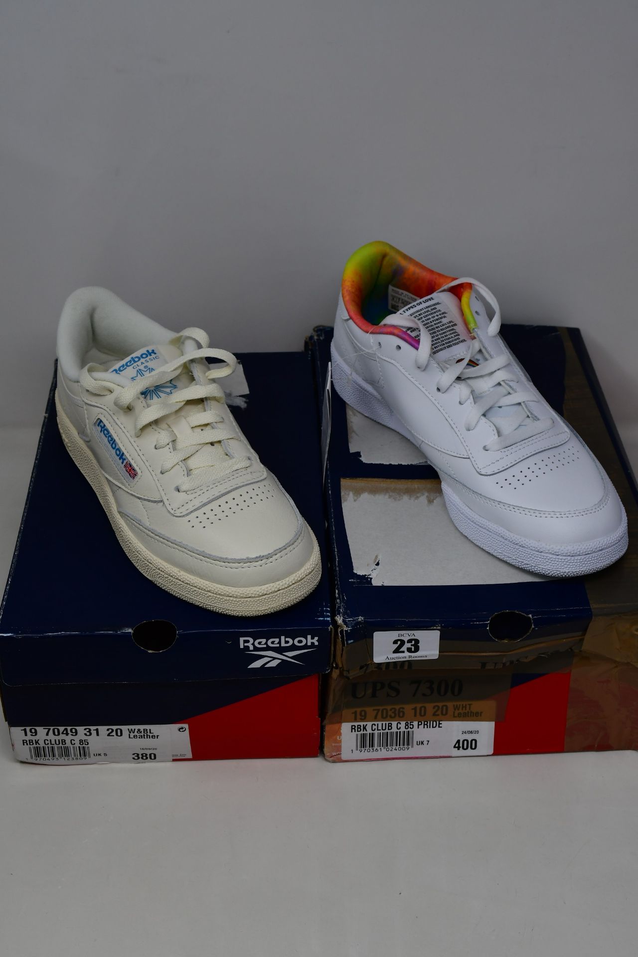 Two pairs of as new Reebok trainers; Club C 85 (UK 5) and Club C 85 Pride (UK 7).
