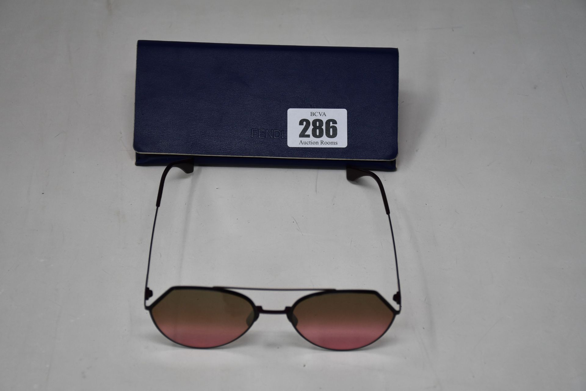 A pair of pre-owned Fendi Eyeline 55 mm plum sunglasses (Excellent condition).