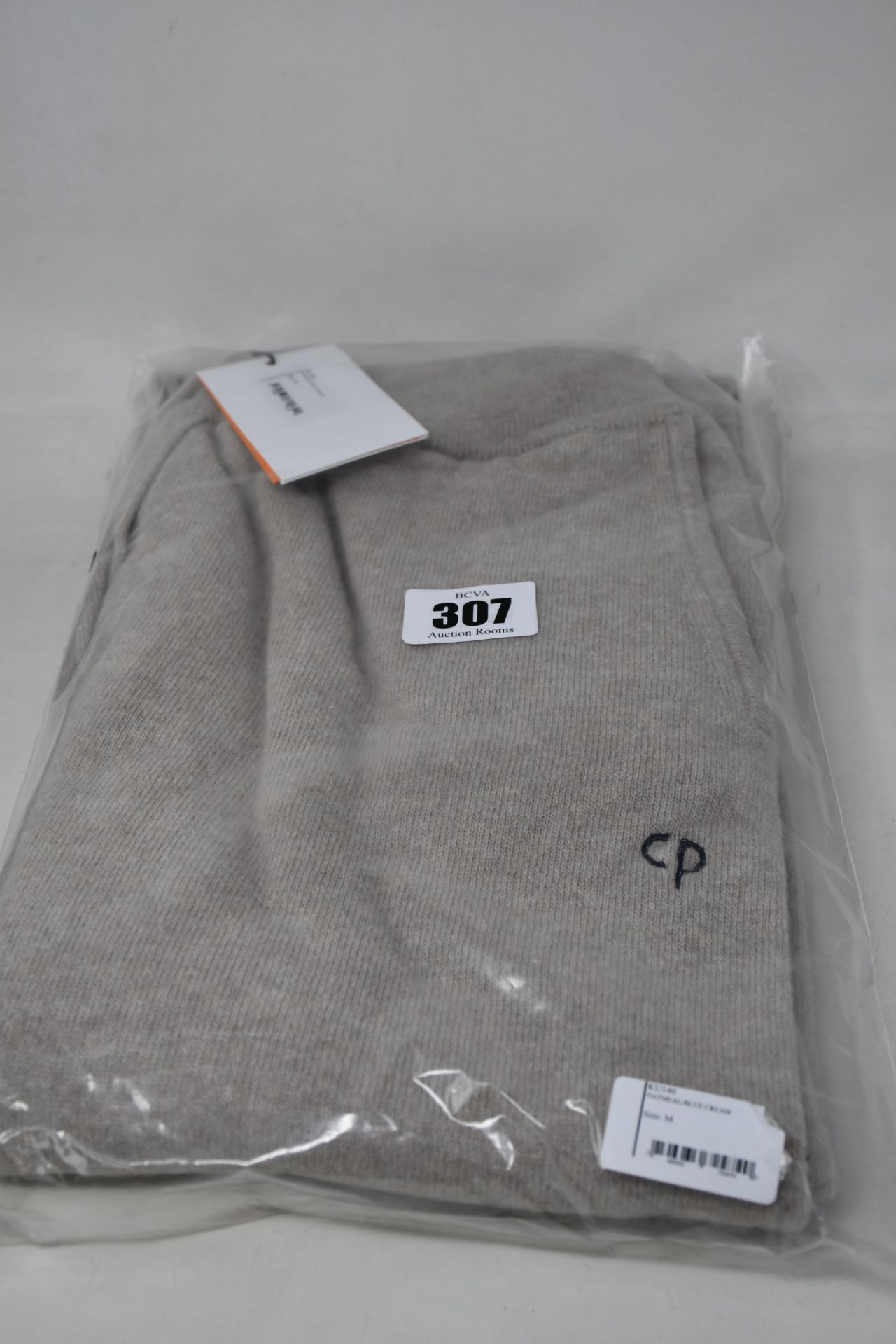 A pair of as new Chinti & Parker cashmere sweatpants in oatmeal with blue/cream ankle cuffs (M).