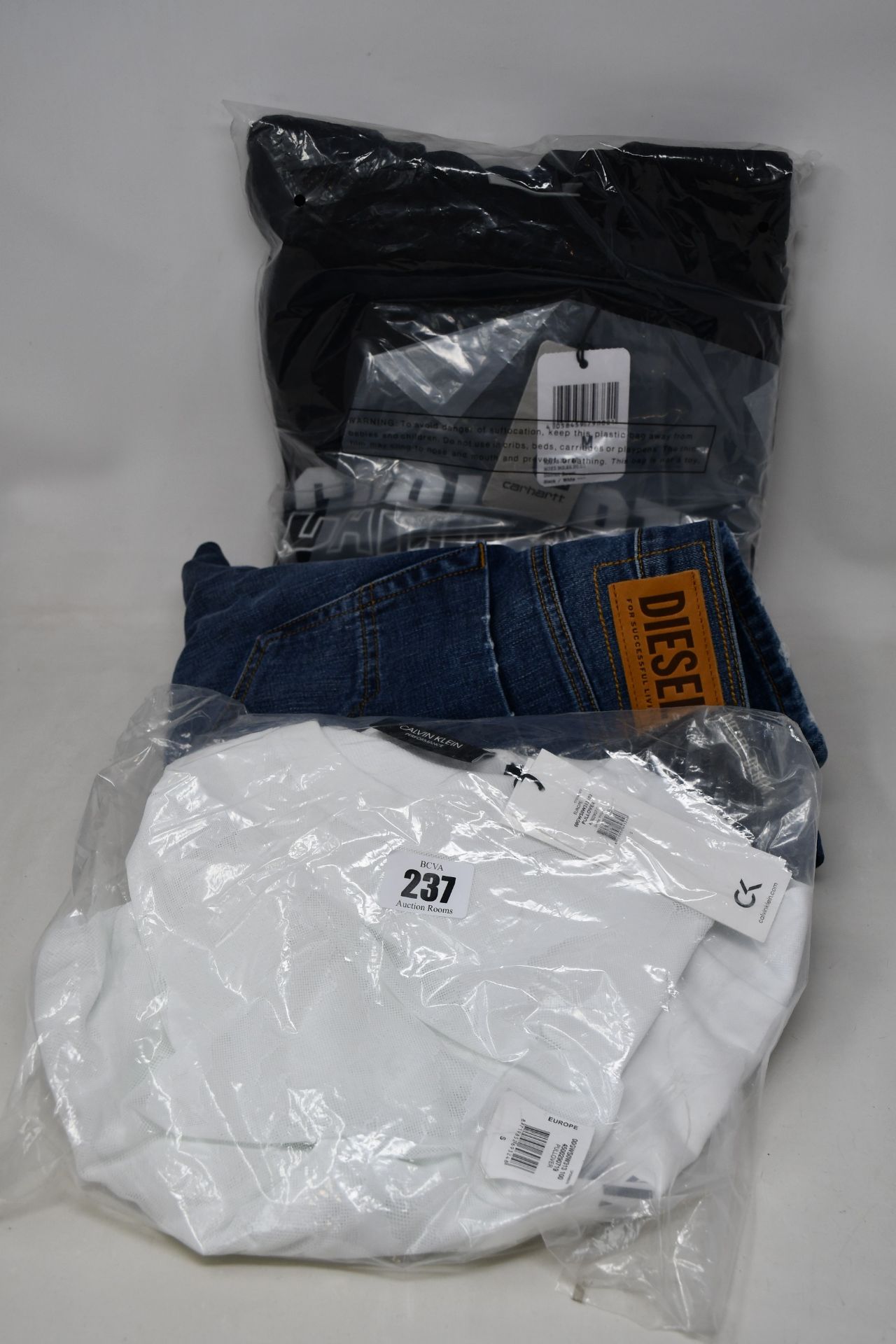 An as new Carhartt District sweater (M - RRP £60), Calvin Klein Performance sweater (S) and a pair