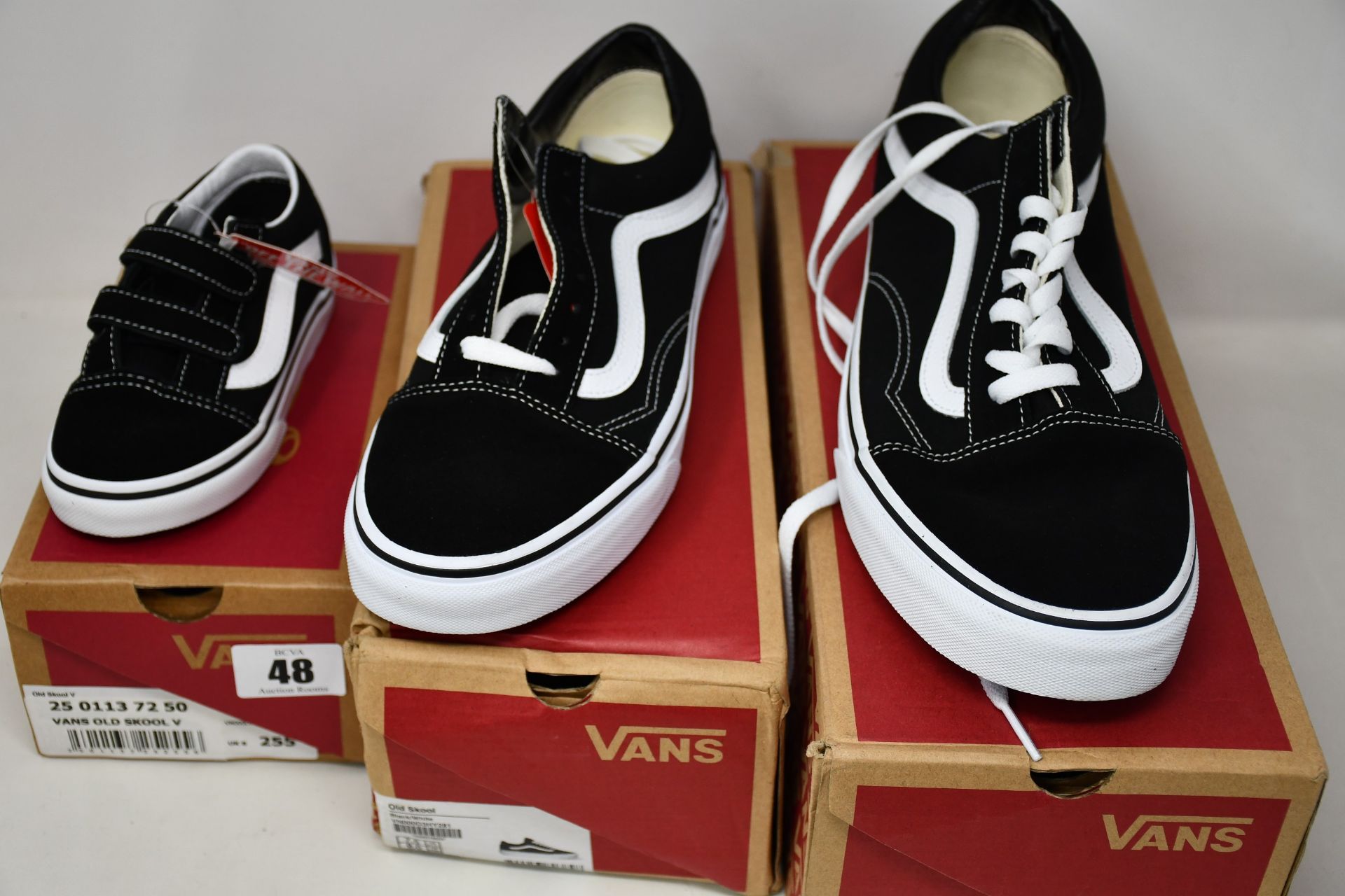 Two pairs of adult as new Vans Old Skool (UK 6.5, 12) and a pair of infants Vans Old Skool (UK 8).