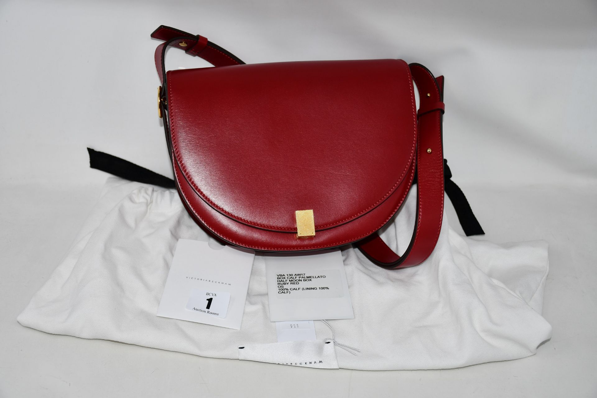 An as new Victoria Beckham Half Moon handbag in rub red Palmellato leather with dust bag.