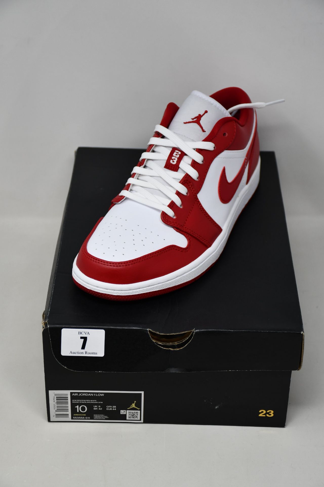 A pair of boxed as new Nike Air Jordan 1 Low Gym sneakers in red and white (UK 9).