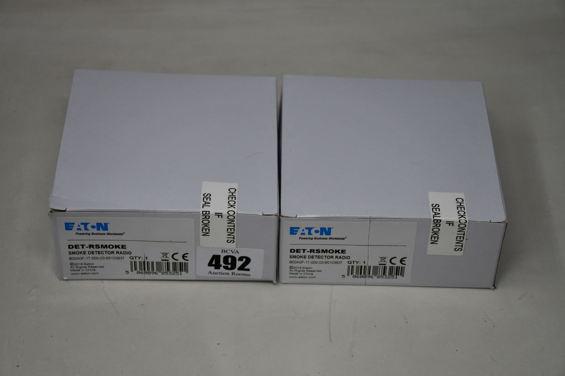 Eight boxed as new Eaton DET-RSMOKE radio smoke detectors.