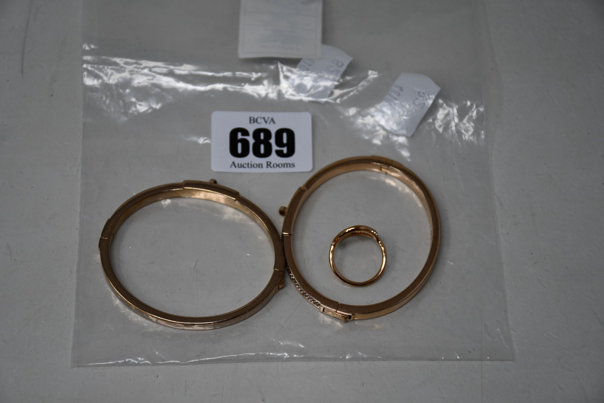 Two pre-owned Michael Kors hinged bangles both lacking charms and a pre-owned Michael Kors ring size