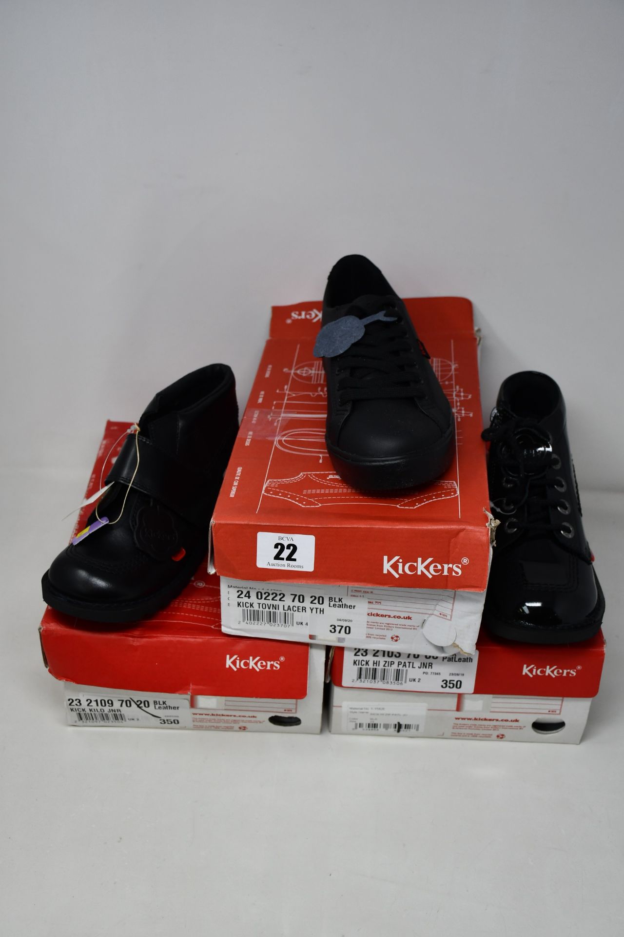 Three pairs of junior Kickers shoes; Tovni Lacer (UK 4), Kilo (UK 2) and Hi Zip Patl (UK 2).