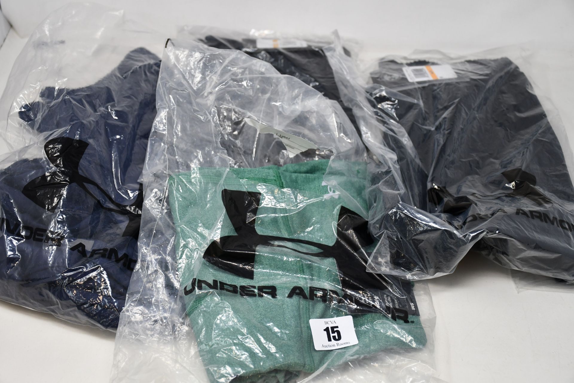 Six items of as new Under Armour sportswear; Project Rock all over print T-shirt (S - RRP £28),