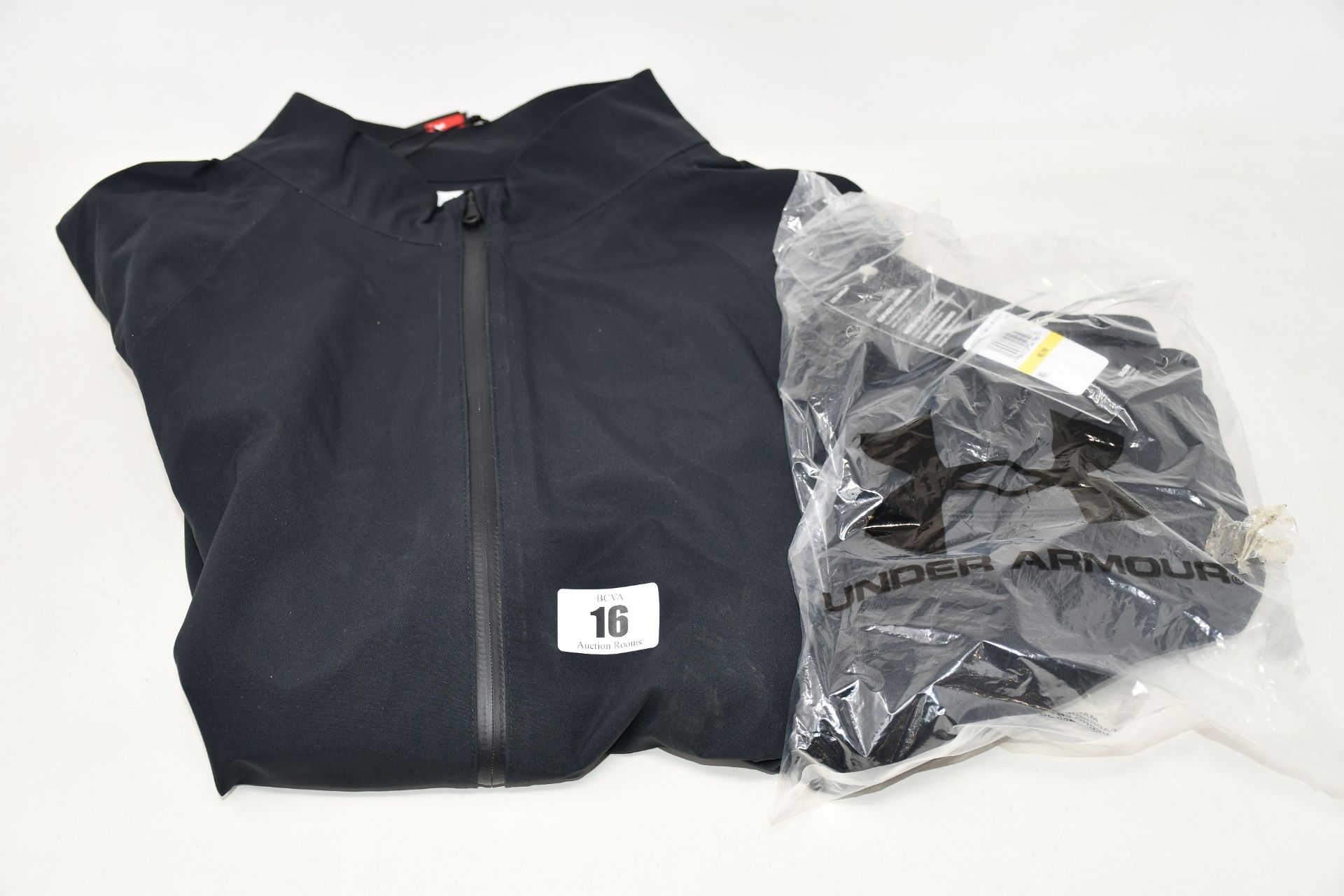 A women's as new Under Armour golf rain jacket (M - RRP £130) and a pair of women's Under Armour