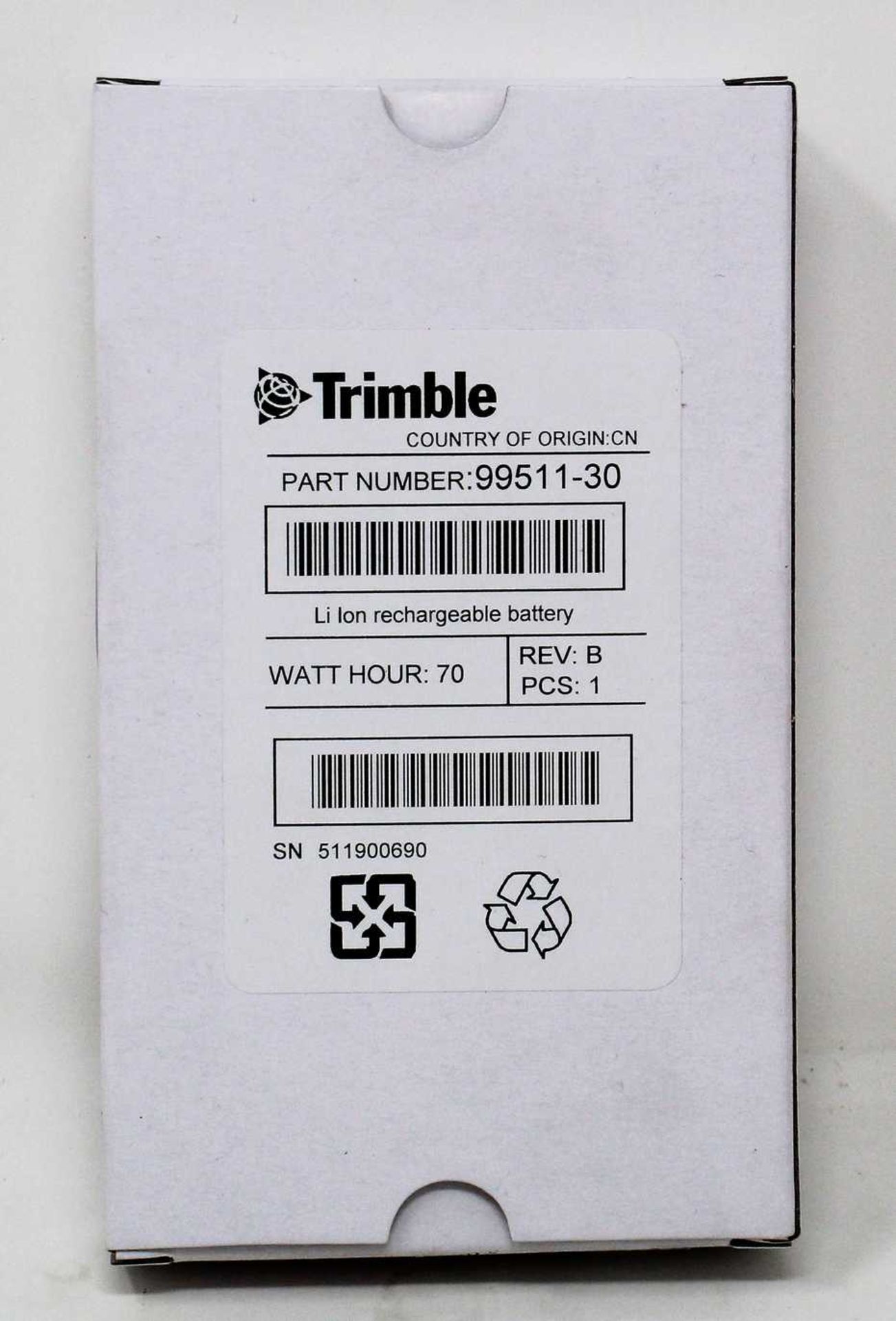 A boxed as new Trimble Rechargeable Li-Ion Battery For Robotic Total Stations (P/N: 99511-30).